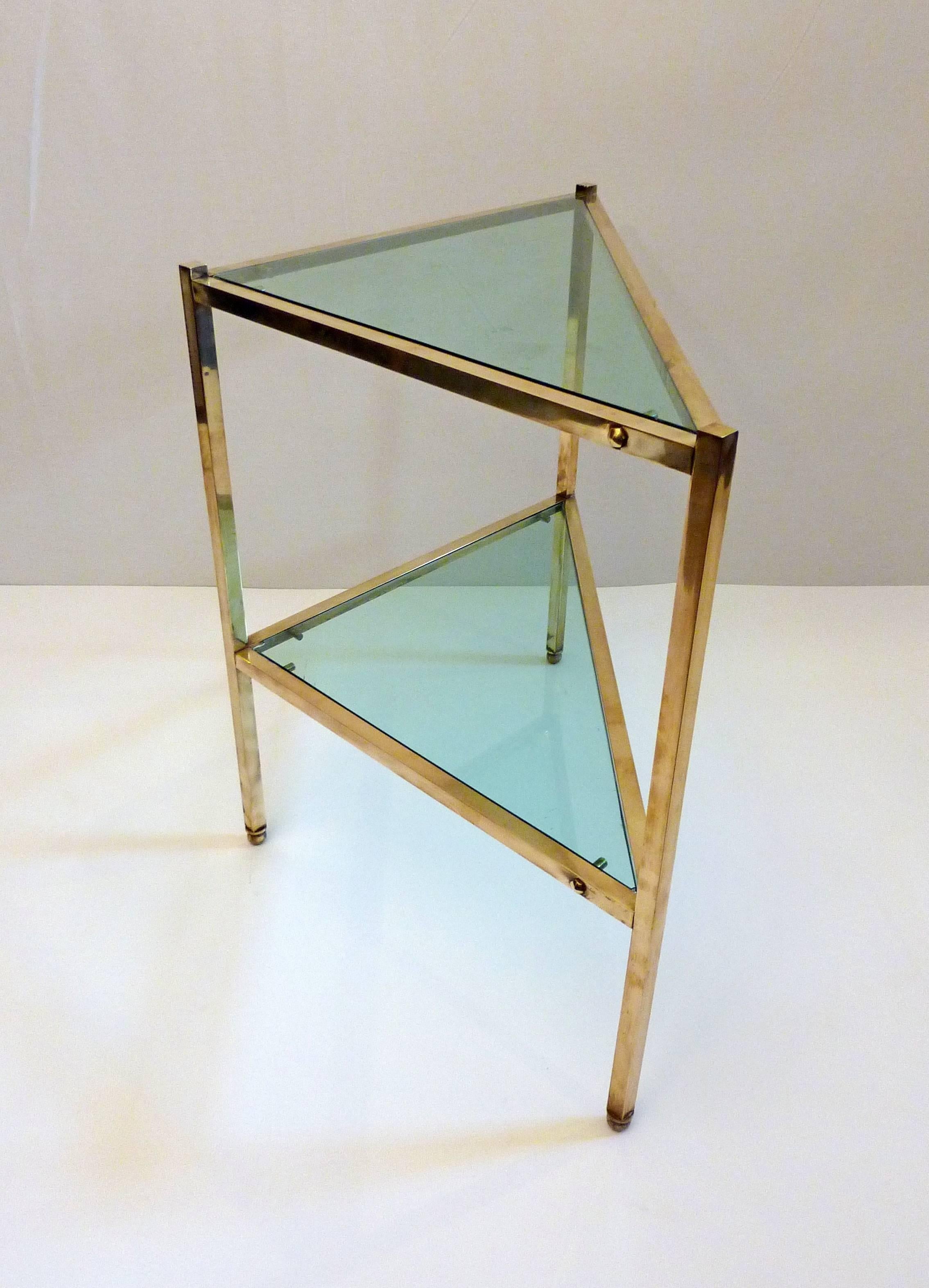 Unusual side table in brass with original glass. Great detailing and composition.