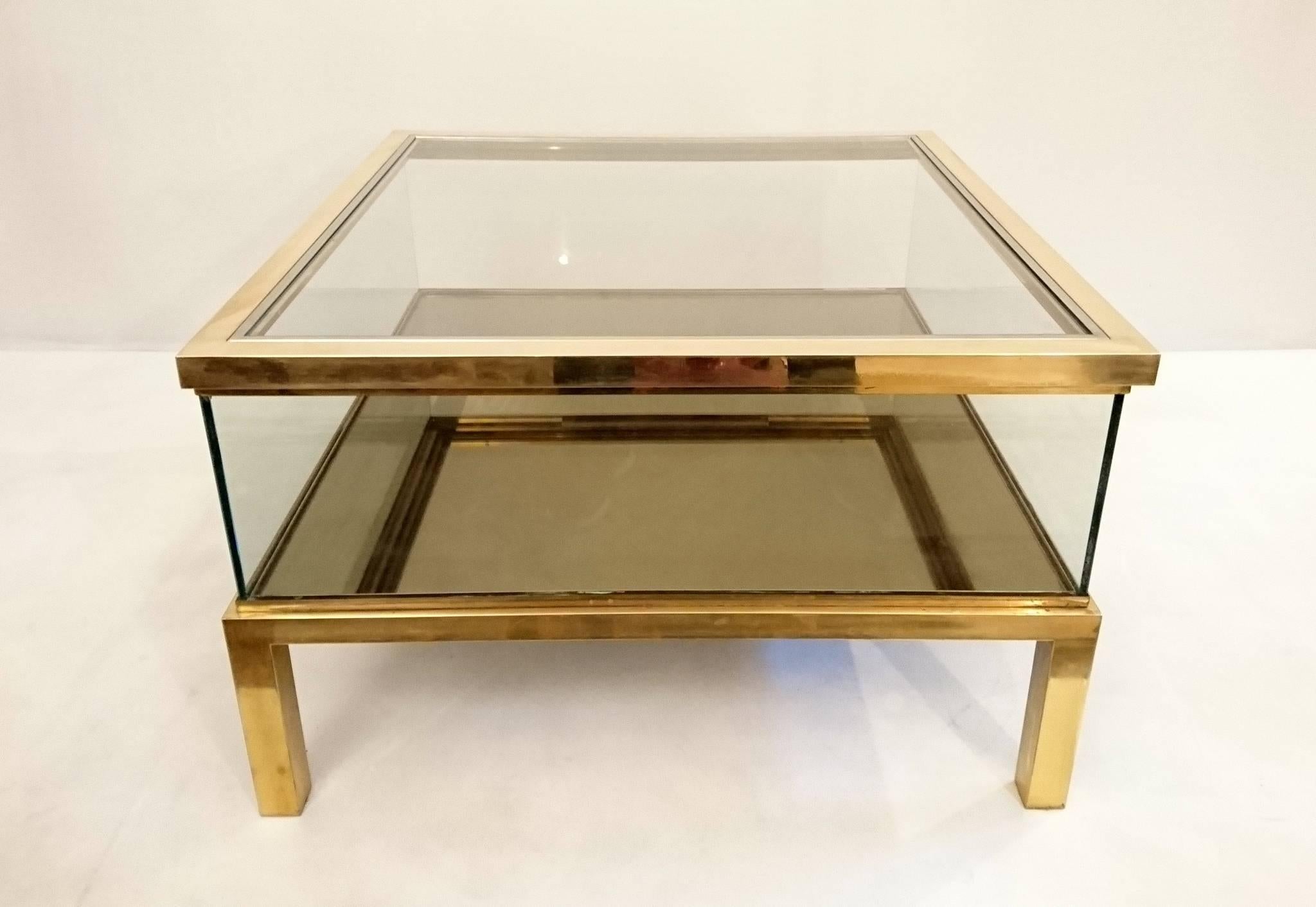 Italian table with a sliding top in brass and chrome. Smoked mirror glass at the bottom of the table and clear glass sides and top. Excellent quality.