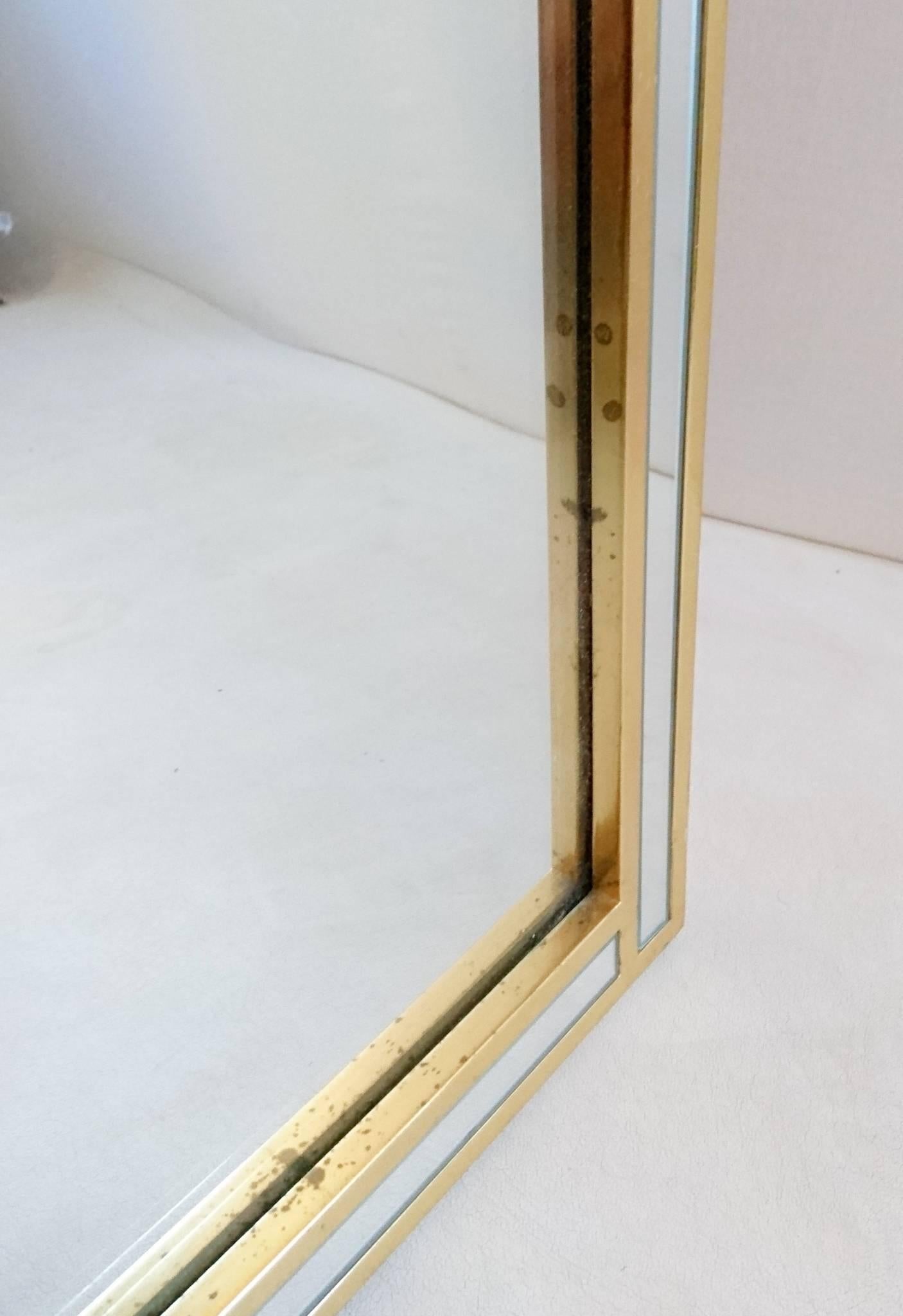 Belgian made mirror with gilded edges set with mirror glass in an Art Deco style. The mirror still retains the sticker which is a control mark as well as it states that this model is patent registered.