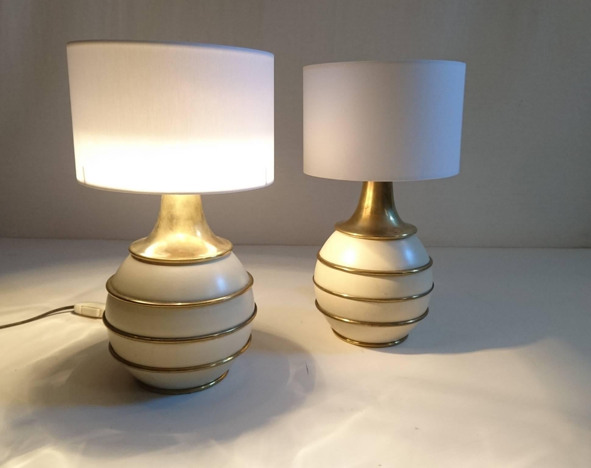 Exquisite lamps of a very high quality and quite solid/heavy by Italian producer PAF. Made in brass and ivory colored powder coated metal. Comes with brand new white shades in cotton.
Should you want other lampshades be it shape, size or color we