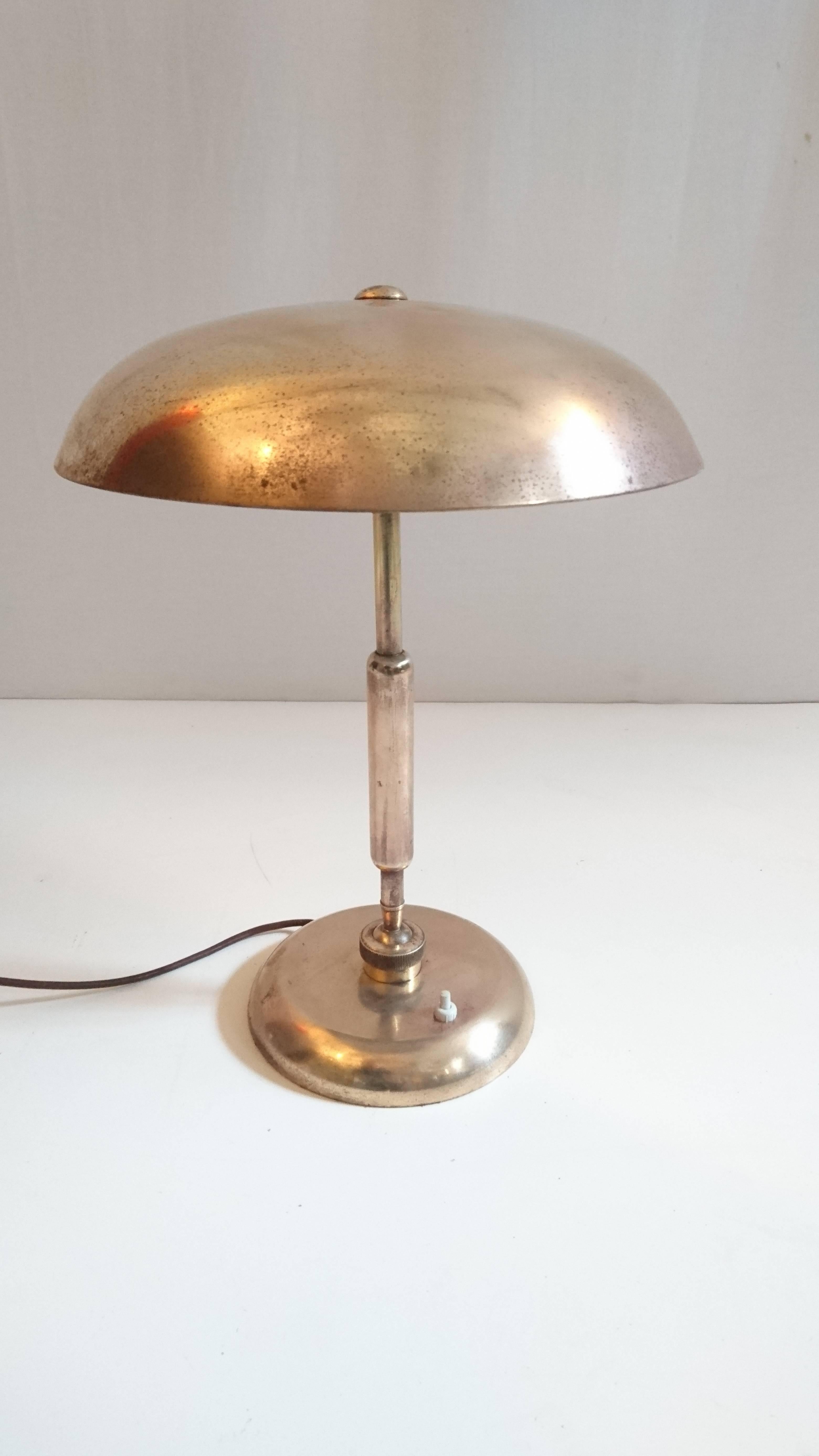Desk made in Italy in brass with two adjustable points to adjust the position of the lamp. Has a heavy base to support the angle of the lamp.