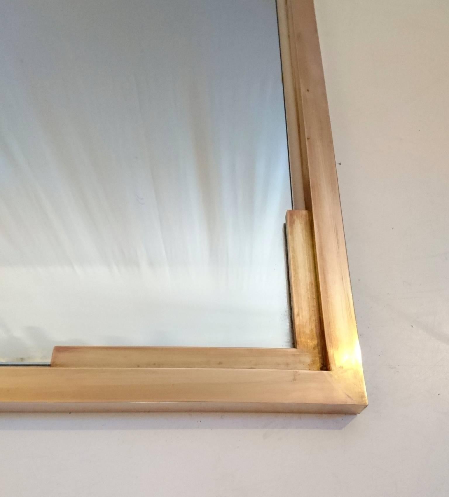 Grand and unique full length mirror in with solid brass frame. Can be placed on the floor or on the wall. The glass has some color spots and can be changed upon request.