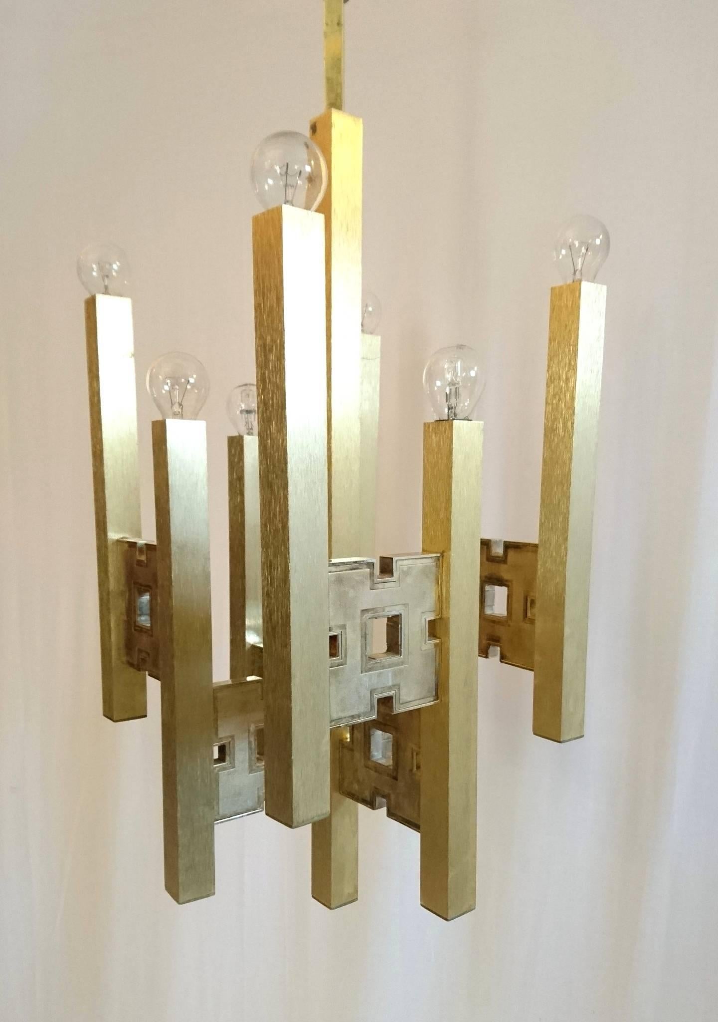 Unusual chandelier by Sciolari with geometric squares holding square brass rods. In full working condition. Measurement is with the rod included.