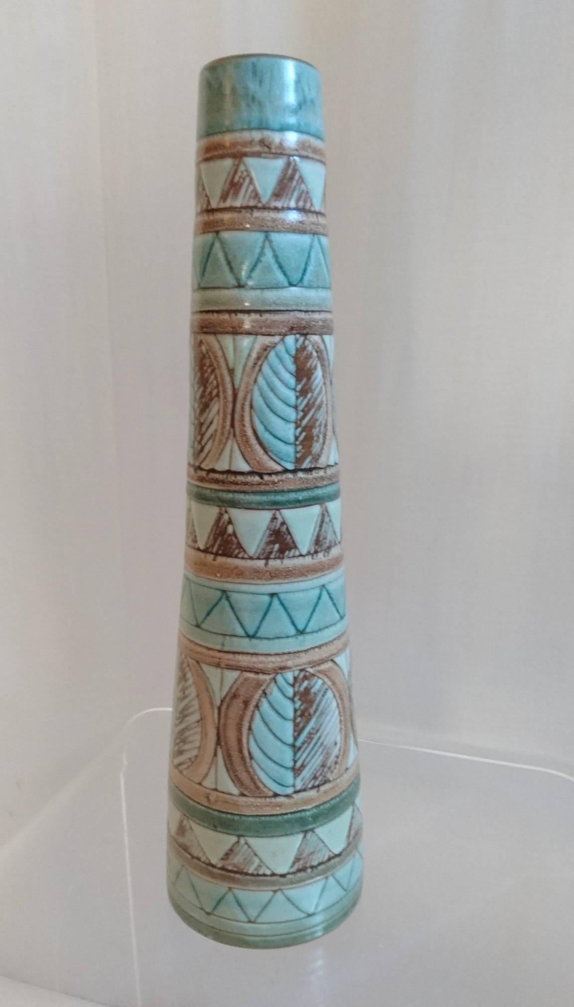 Tall cone shaped ceramic vase from the 1950s with leaves, stripes and triangles in pale turquoise/blue and browns.