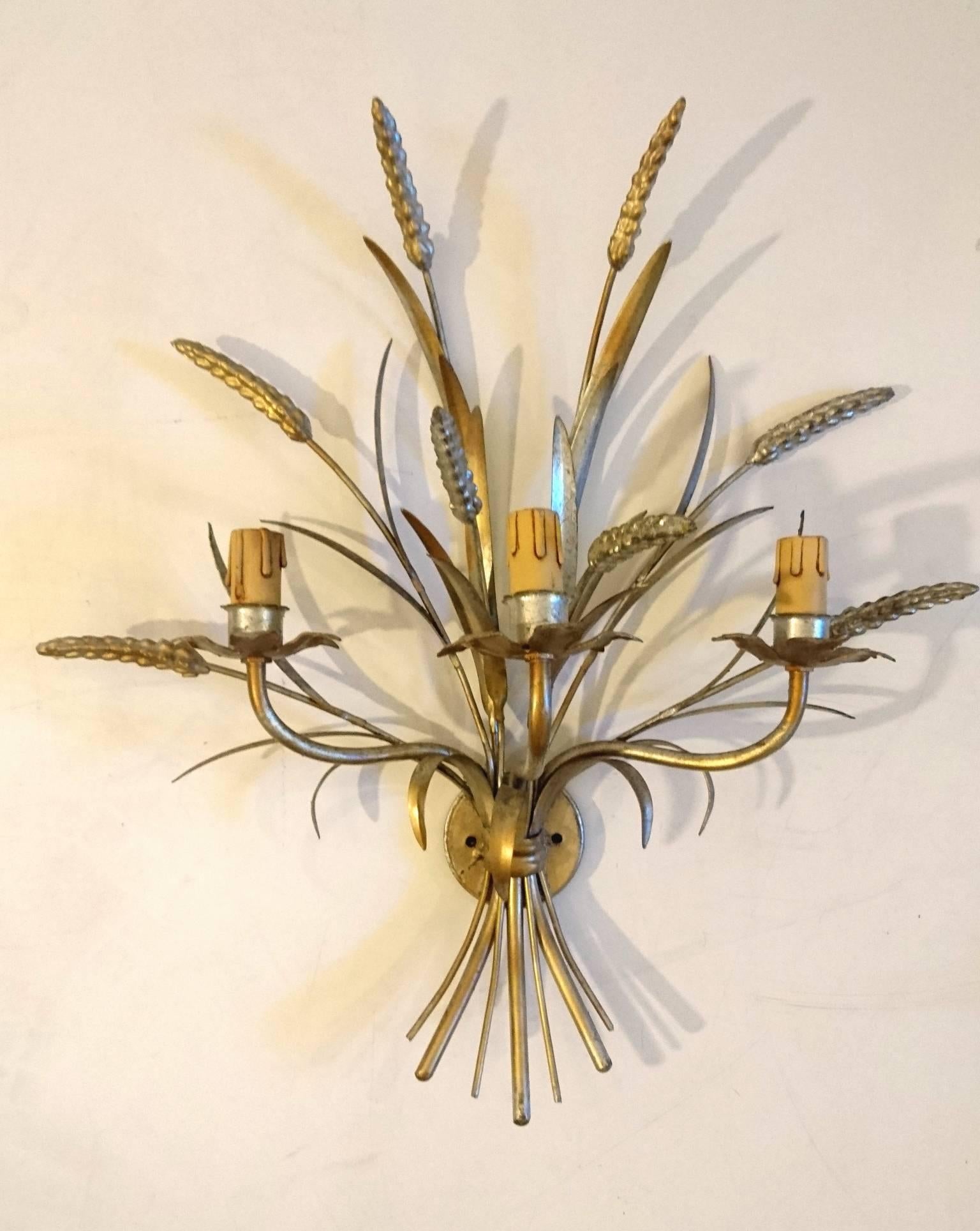 Pair of Italian gilt wheat sheaf sconce with three lights each. In very good condition with gold/silver guilding as well as the original candle covers. They have not been rewired but are in great condition.