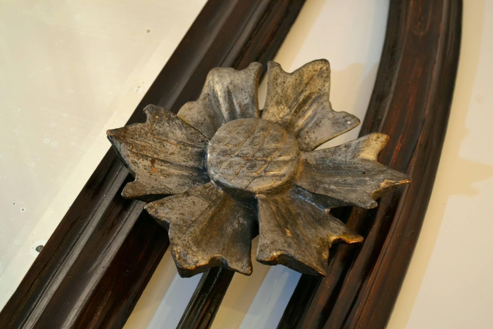 Hand-carved mirror in tulip wood with silver gilding. Decorated with carved thistles, which is the national flower of Scotland from the Art Nouveau period, circa 1900. Reminiscent of the style of Macintosh and artist Aubrey Beardsley. The mirror