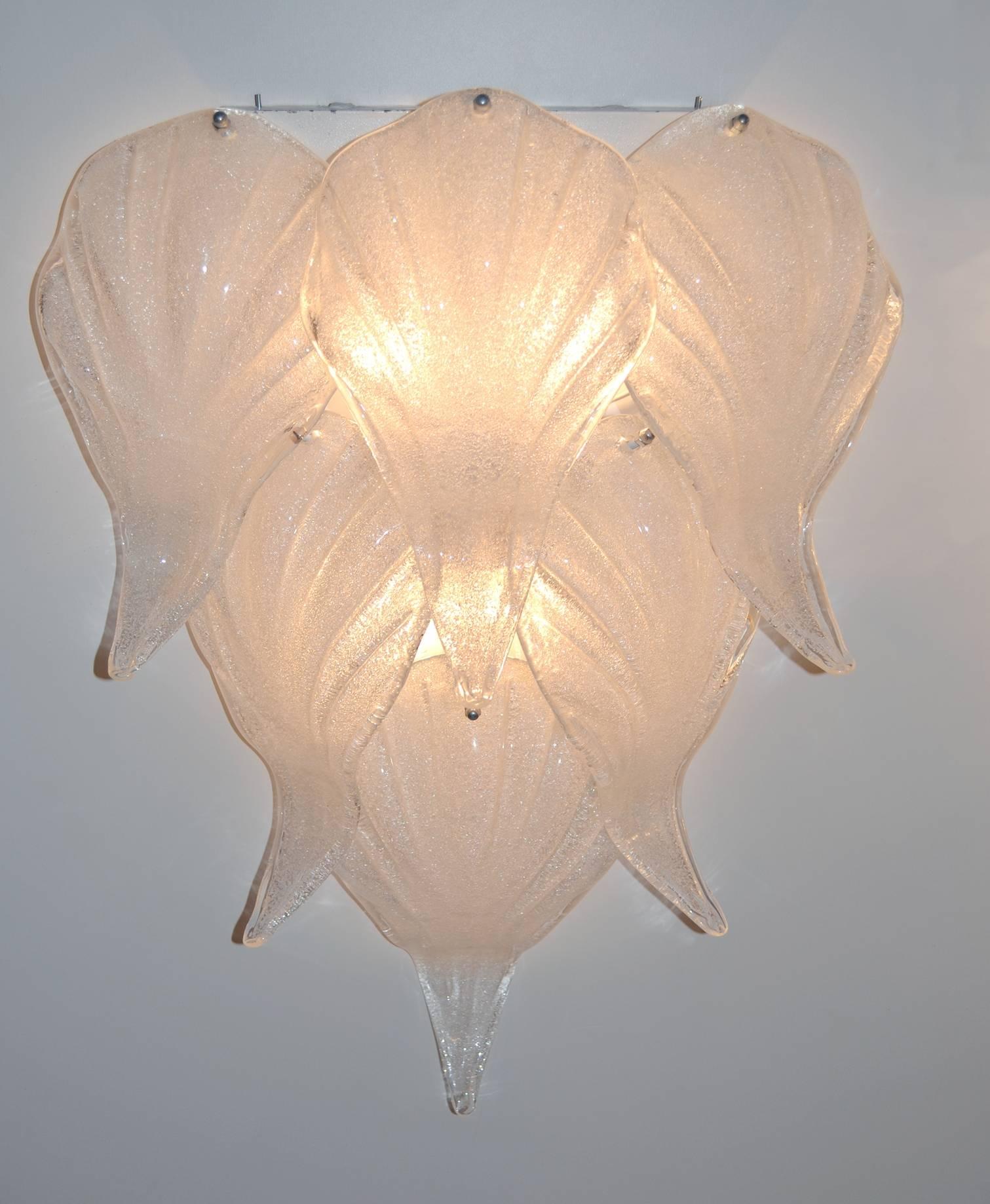 A large pair of wall sconces with amazing frosted glass leaves. Each sconce has six-glass leaves and there are room for four lightbulbs on each sconce. New wiring that will work in the US as well as Europe. No chipping to the glass. Depending on the