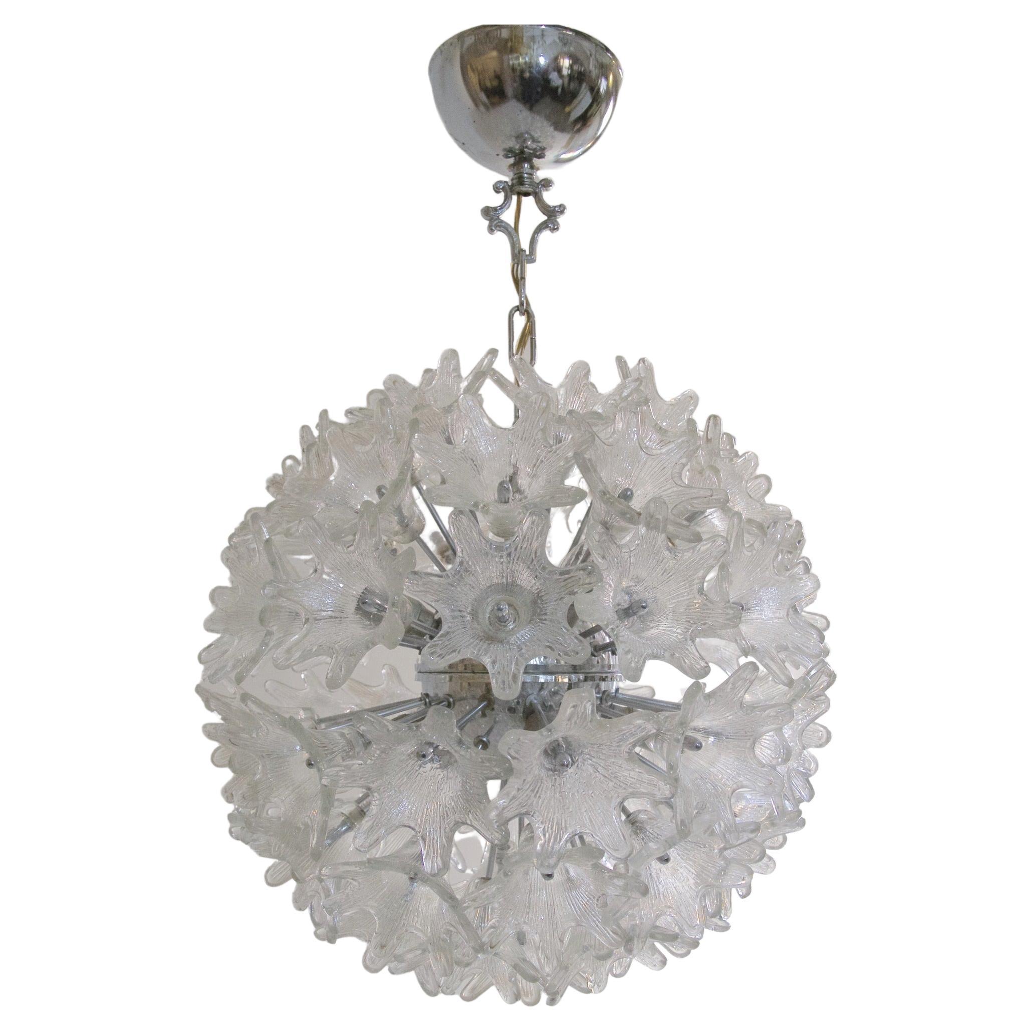 Large 1960's Murano Sputnik flower chandelier designed by Paolo Venini for VeArt Italy with clear glass flowers and a chrome structure. The lamp takes eight small screw-in Edison E14 bulbs.