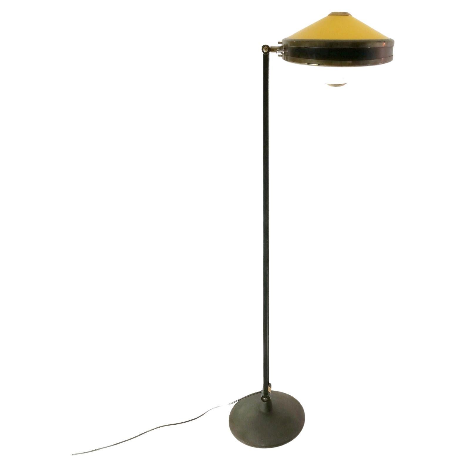 Black lacquered steel and metal, brass, yellow and white tinted Perspex mod. 4067 floor lamp by Stilnovo
In very good condition and well-functioning. 

Domus, no. 380, July 1961, p. 15
Roberto Aloi, L'arredamento moderno, Settima Serie, Milan,