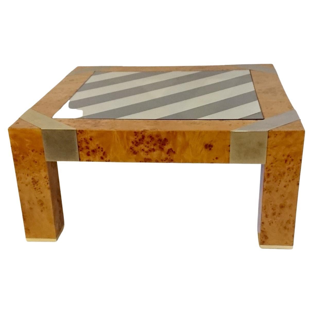 Italian coffee table in burl veneer with a diagonally striped glass top in gray. Details in metal on the corners as well as on bottom of the legs.