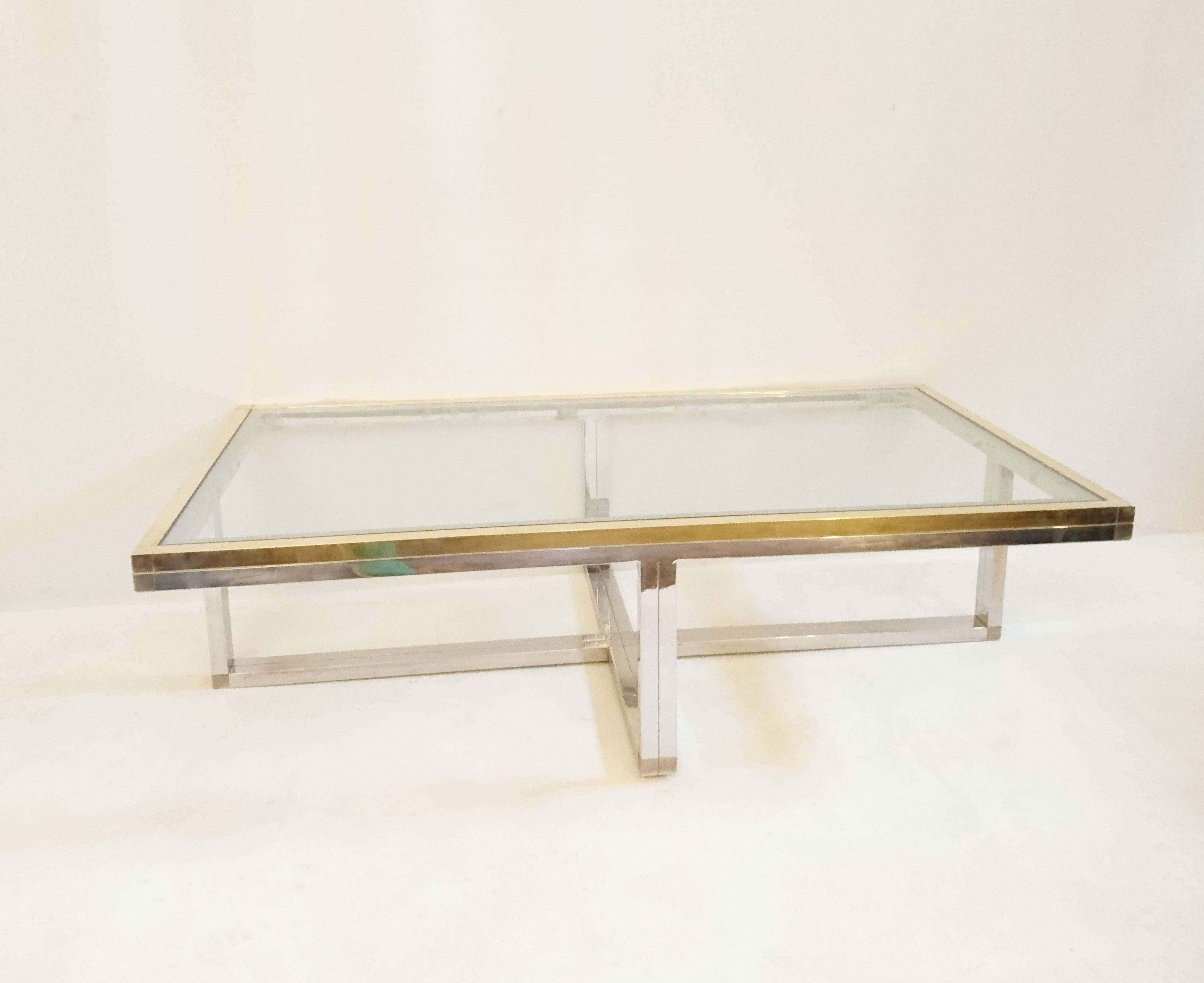Coffee table in Classic Romeo Rega design in brass and chrome with a clear glass top.
