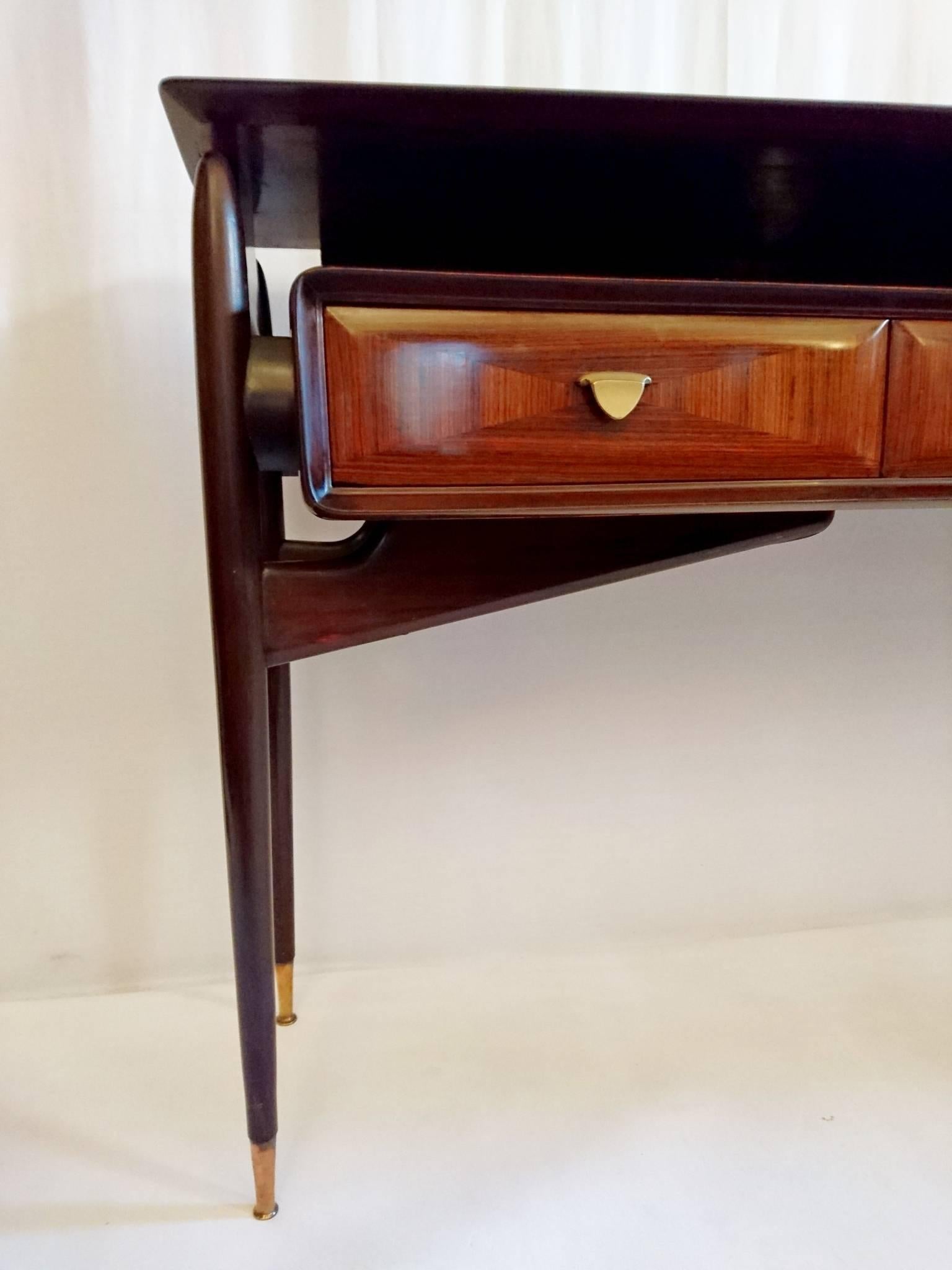 Console table on a mahogany structure and with rosewood veneer. Blond interior of drawers in beech. Produced in Cantu, Italy in the style of Osvaldo Borsani and Ico Parisi.