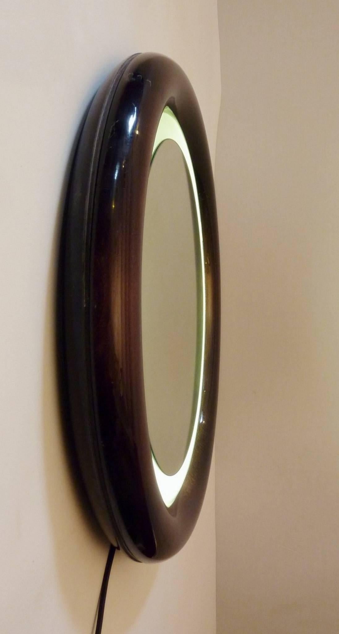 Italian mirror with a round beech frame in high gloss lacquer with back light.