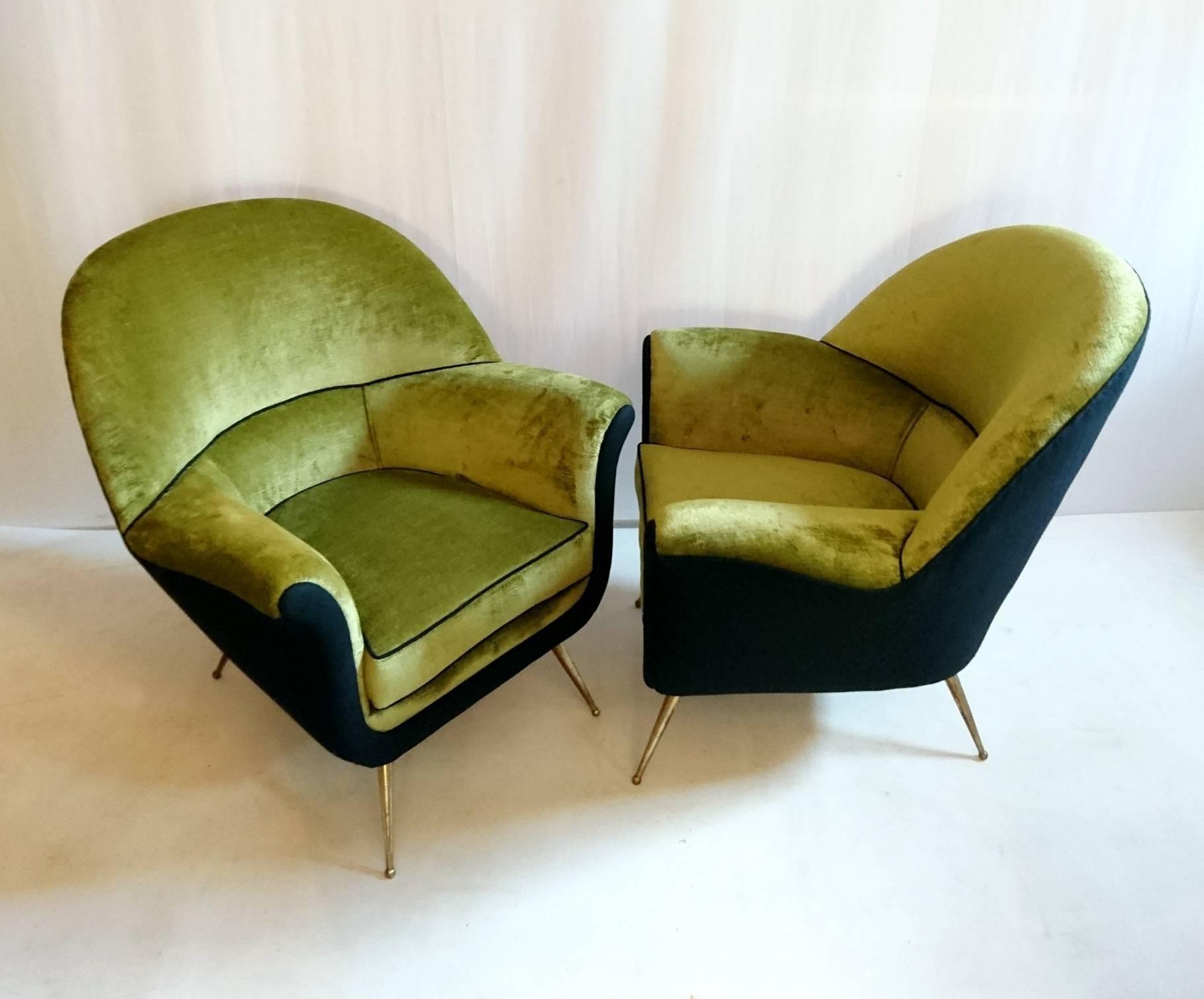 This pair of armchairs has a great design with rounded forms as well as being very comfortable. They have recently been professionally completely reupholstered on the inside in a lime green Italian linen velvet and an Italian black soft extra virgin