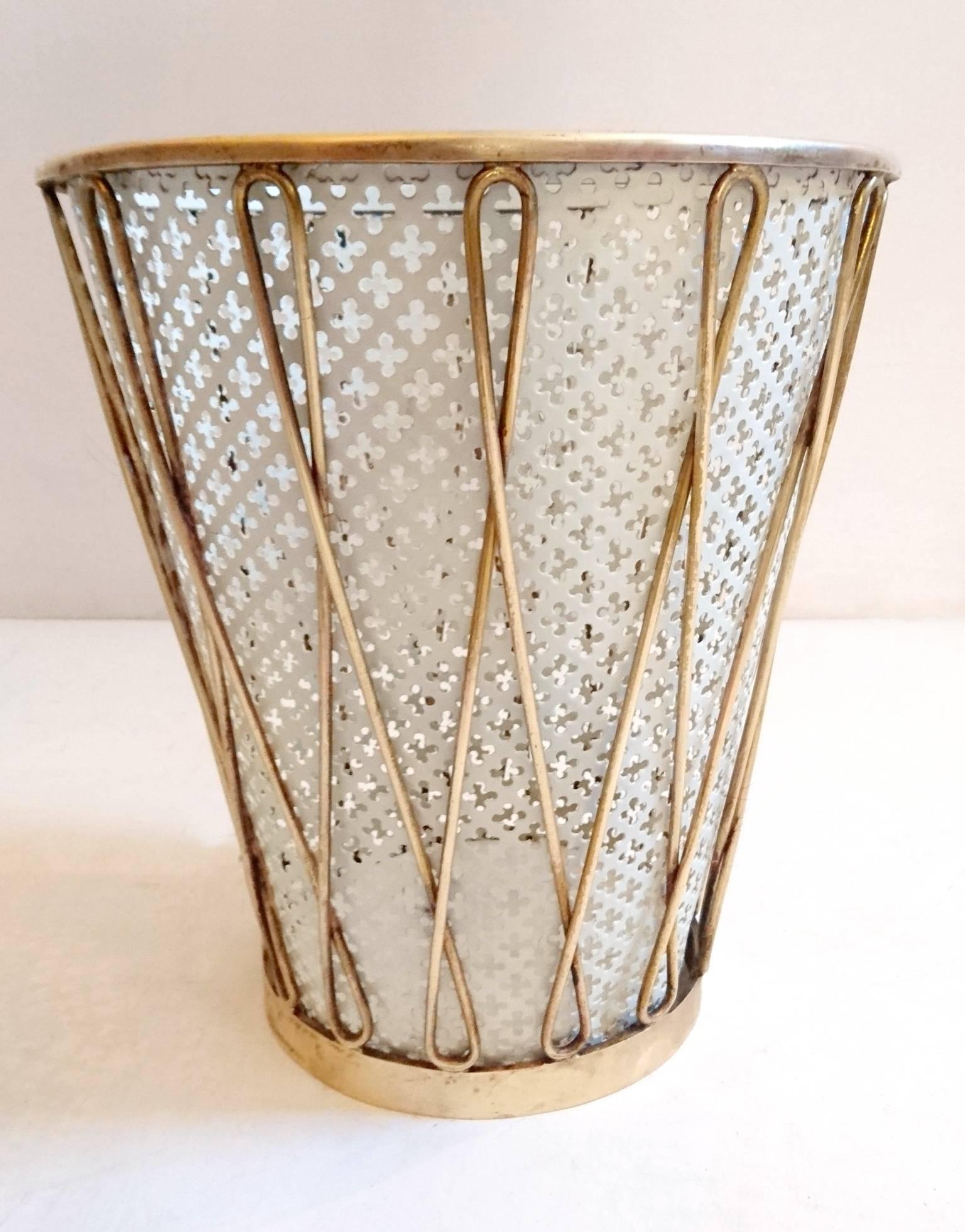 Eegant looking waste paper basket in brass and painted metal made in Italy during the 1950s. One of these has been sold so there is only one left.
