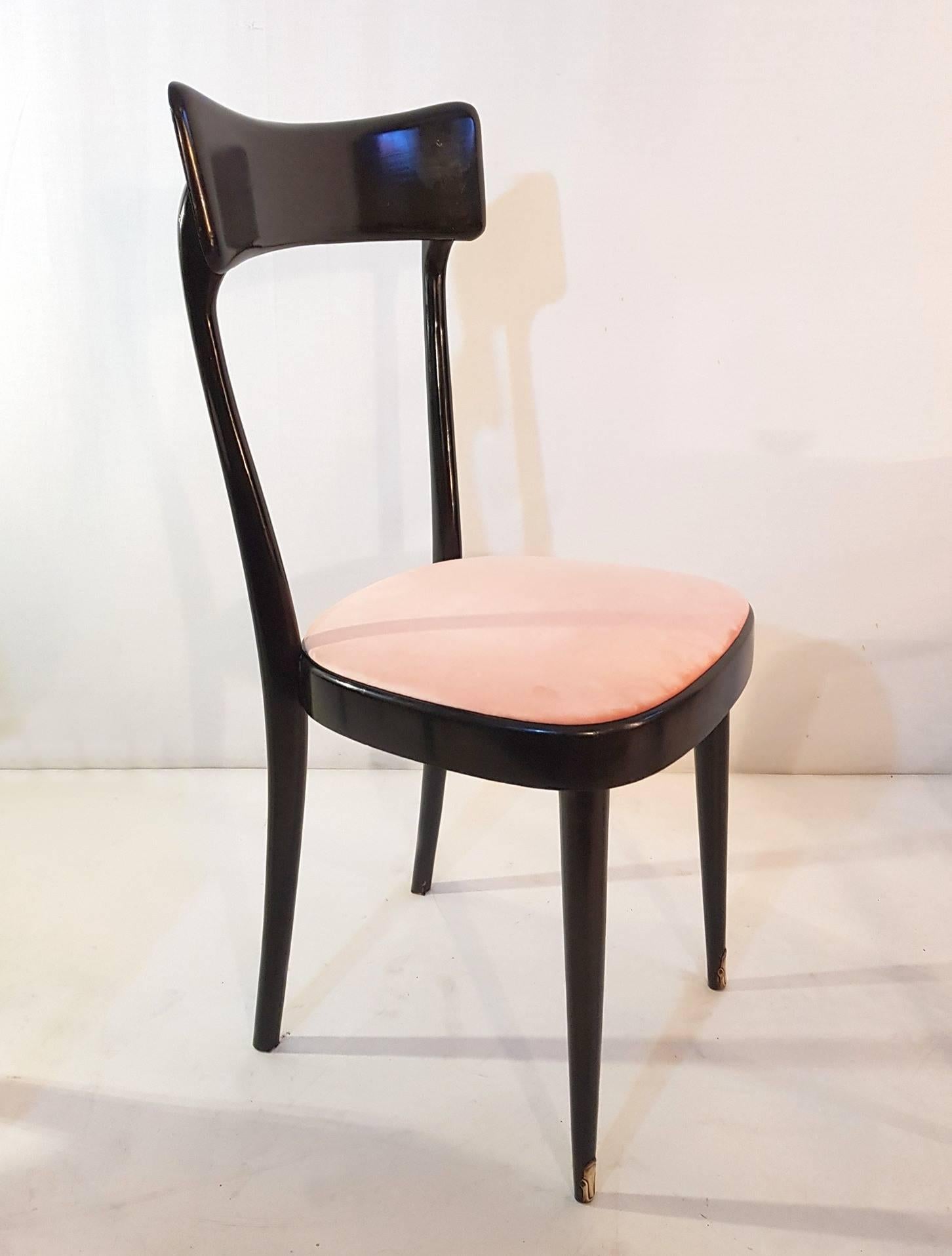 A set of six dining chairs in the manner of Ico Parisi. Made from wood that is stained black and seats covered in a brand new pastel pink cotton velvet. At the base of the legs there are original brass fittings.

These chairs have recently been