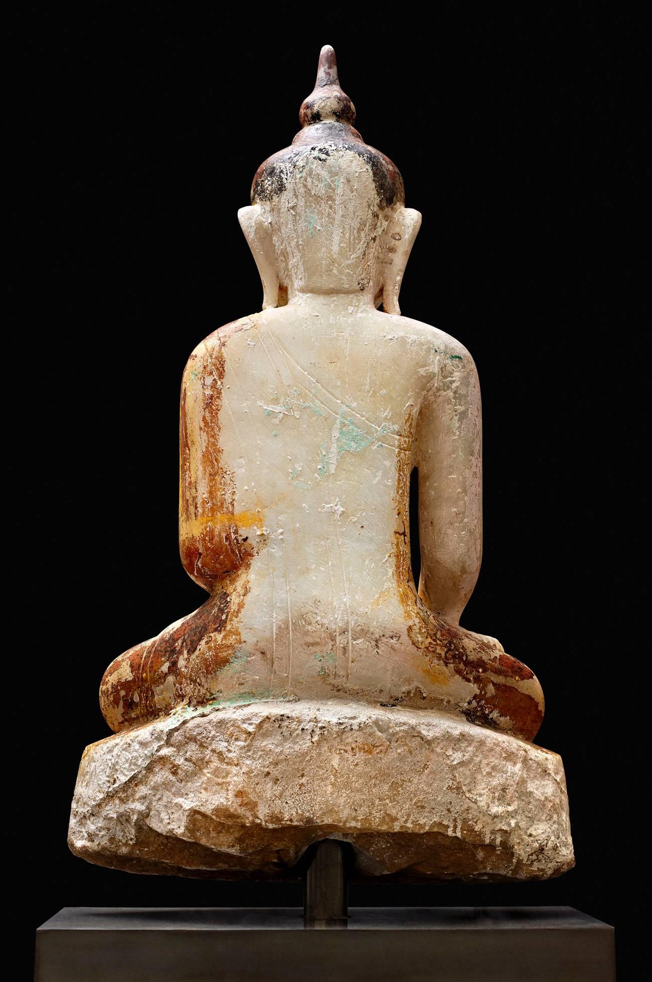 Buddha,
Burma, 17th century.
Carved and lacquered white marble
Measures: Height: 90 cms.
 
