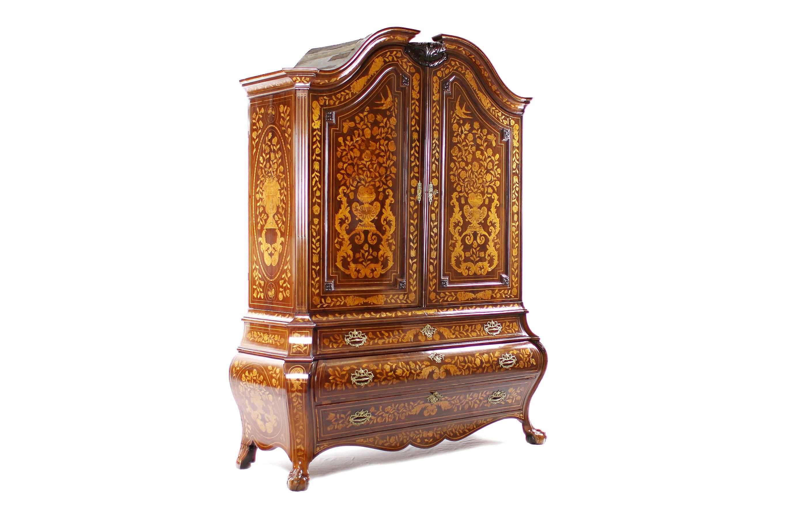 
PS55 unique Baroque cupboard. 
Mahogany veneers on oak body.
The Netherlands, circa 1780.
Divisible, two-door.
Embowed, curved double doors.
Bulbous bottom with three separately closeable pushes.
Original fittings.
Luxuriously and richly inlaid