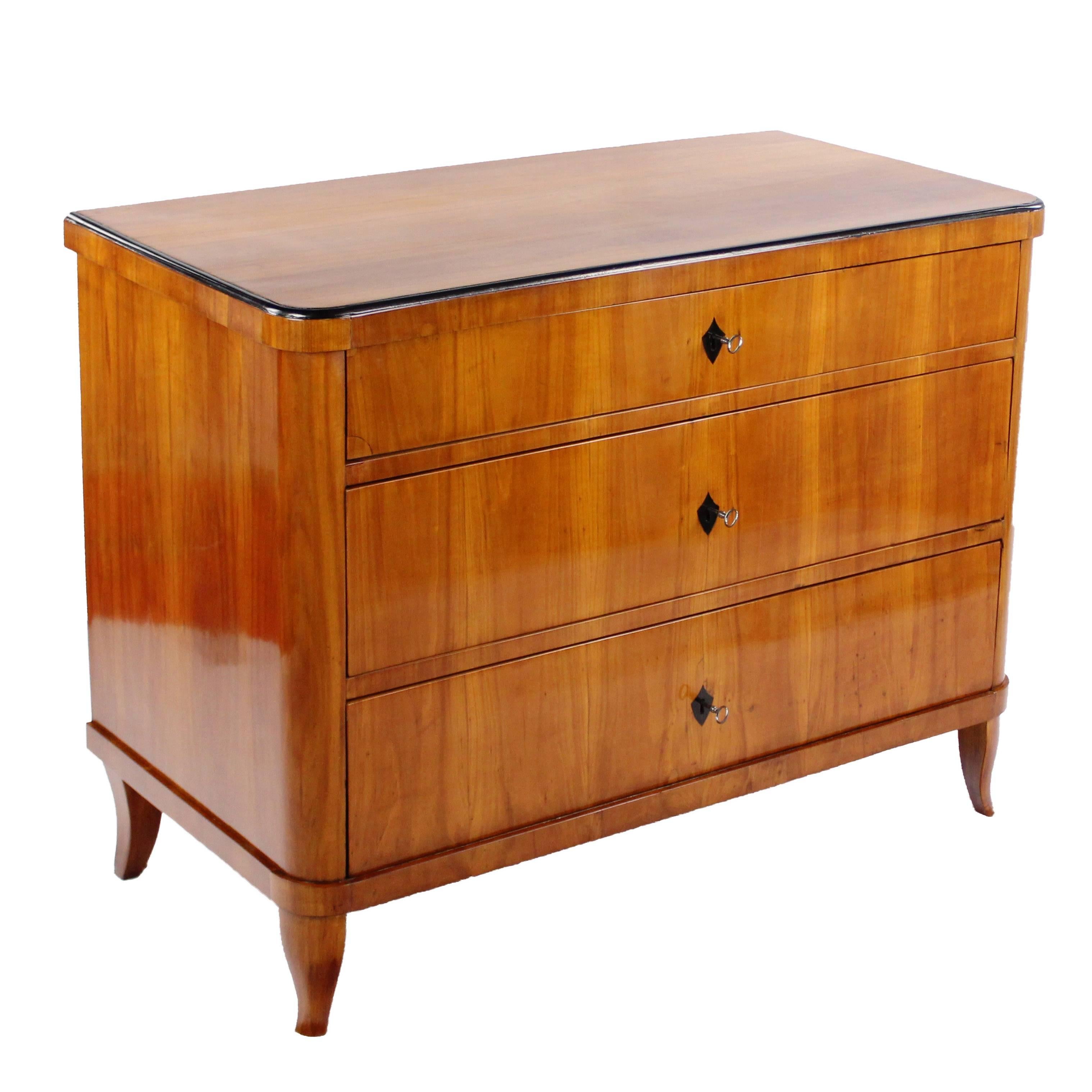 Chest of drawers, circa 1820-1830
Cherry tree on softwood body veneered
Three drawers
Nice veneer image
Rounded corners
Some parts ebonized
Restored residential-ready state
French Shellac hand polish
Height: 85 cm, width: 110 cm, depth: 56