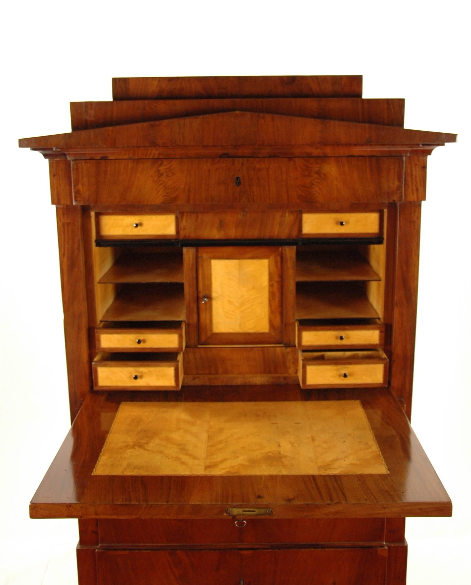 Secretary, circa 1830, North Germany
Nice reflected mahogany veneered
Architectural inner life with birchwood veneered
Strict straight concept
Restored residential-ready state
French shellac hand polish
Measures: Height 164 cm, width 107 cm,