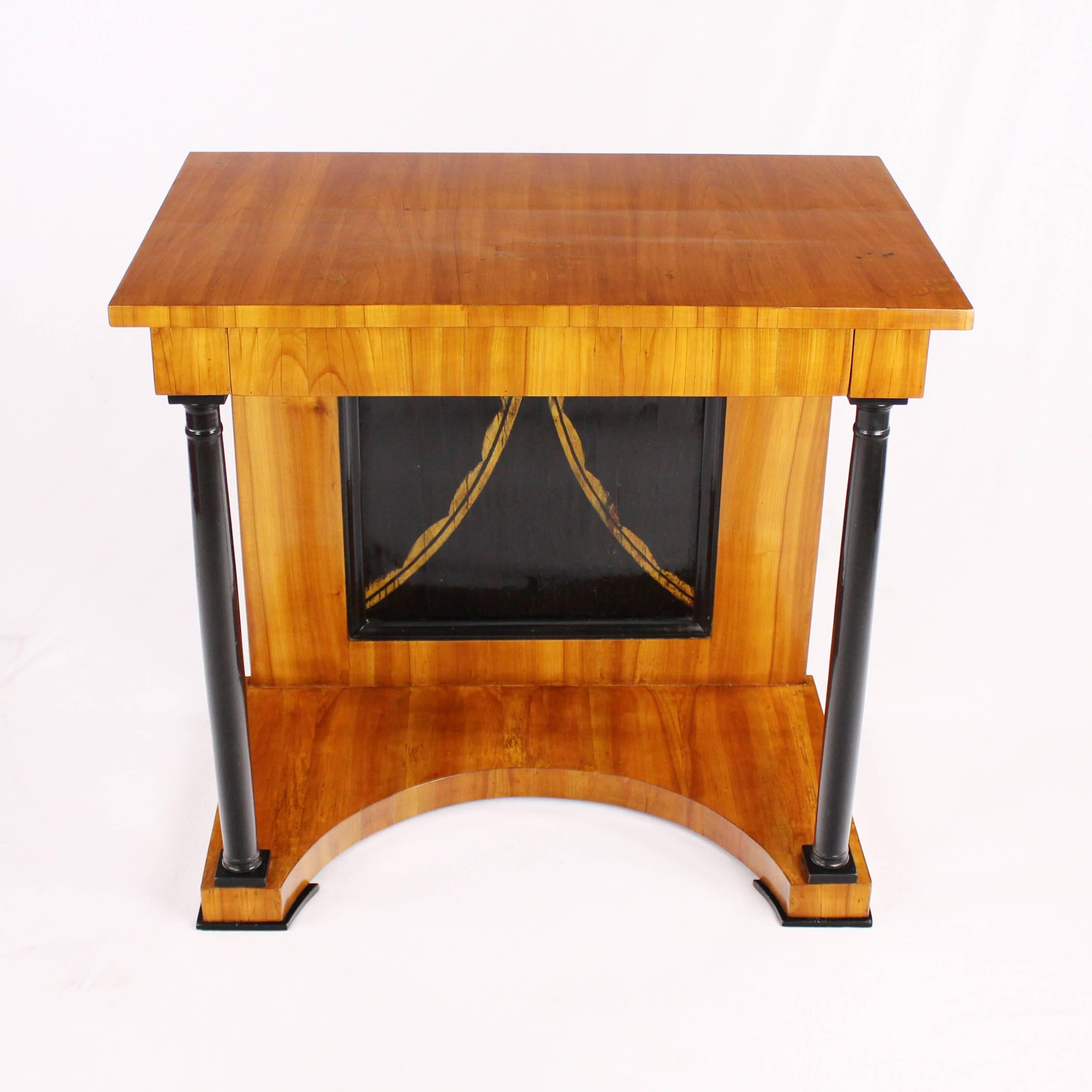 • 19th century Biedermeier period console, circa 1820
• Very rare model
• Cherry tree
• Concealed head push
• On the left and on the right ebonized sculptural full columns
• Restored residential-ready state
• French shellac hand polish
•