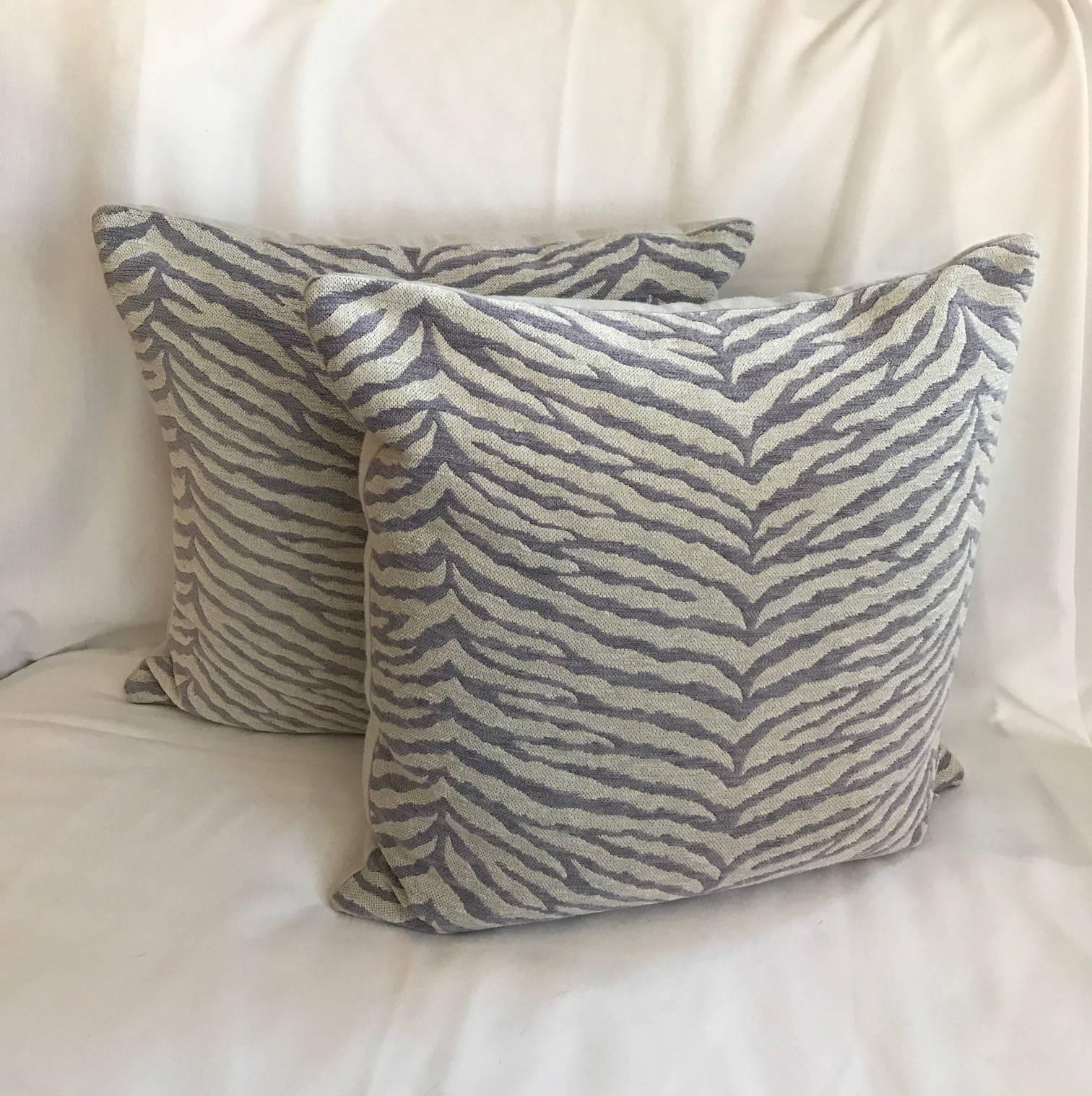 Set of two lavender and white glorious Schumacher fabric pillows. A fun zebra stripped design with an off-white background and backing. Down stuffed. Very pretty.

In 1950, First Lady Bess Truman selected fabric from F. Schumacher & Co. designed