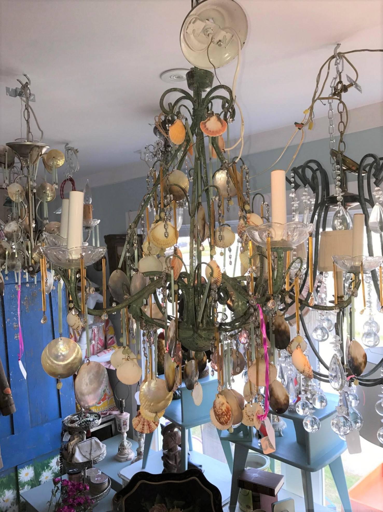 Sea Shell Chandelier --Violet's,  Amber And Sea Colors Adorn This Beauty.  Crystals and Shell's A Beautiful Combination - Dress Up or Dress Down with A Hint of  Beach Simplicity with This Antiqued Beautiful Five-Arm Chandelier.

On Sale Now!