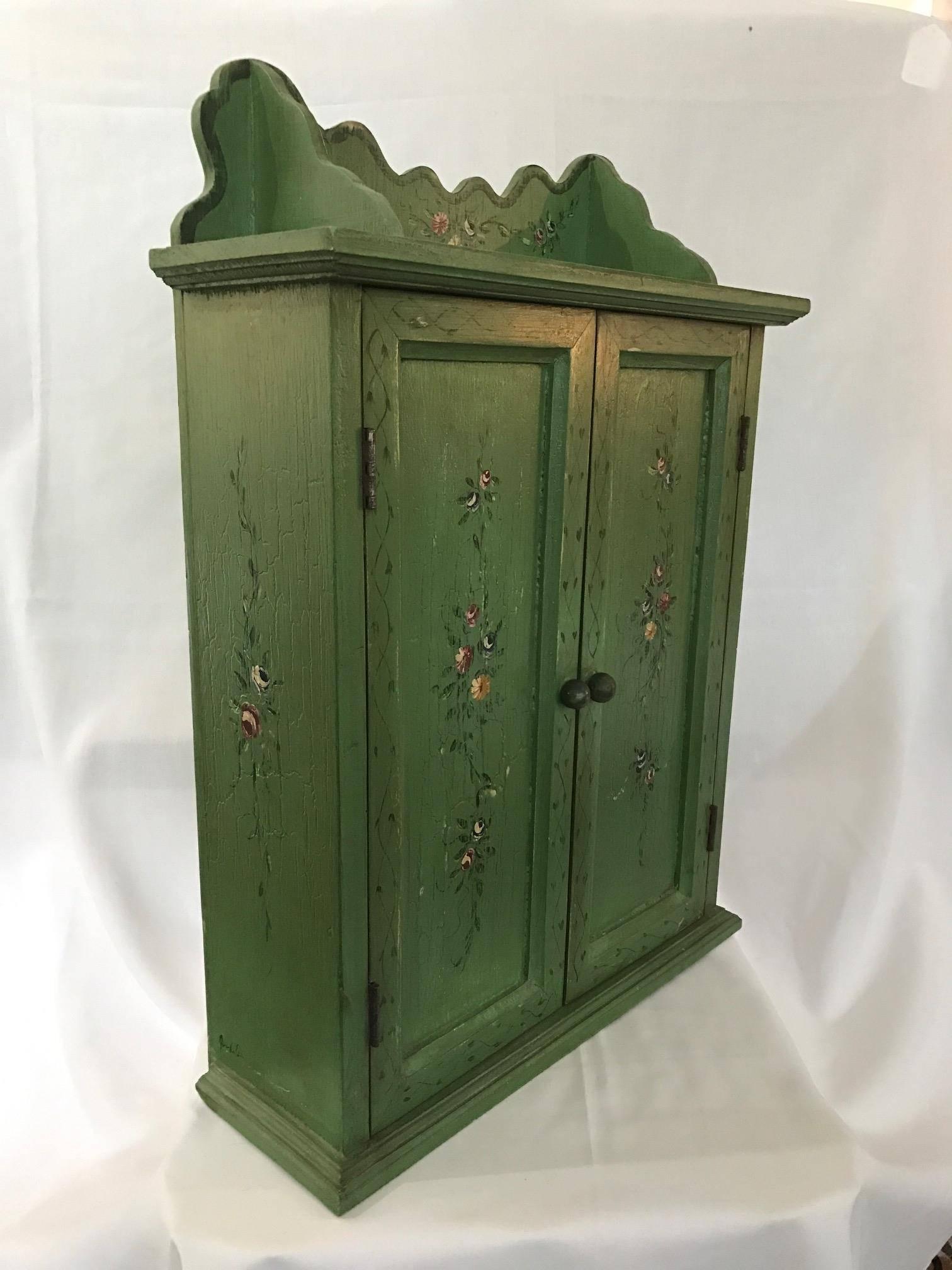 A fantastic signed French revival Giverny garden green cupboard/cabinet hand-painted petite flora's and vines.

 Monet May have found this piece just perfect for his Giverny home. Exquisite scalloped edges and beautiful hand painted craftsmanship