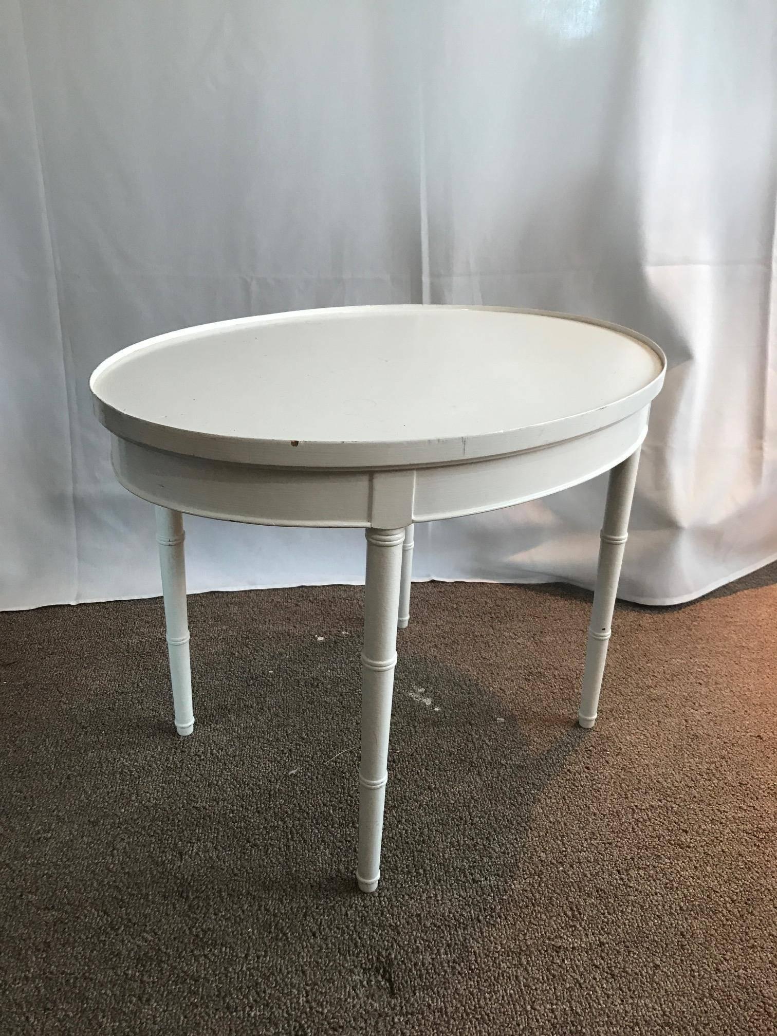 Maison Jansen style pretty as a picture petite white wooden side/coffee table. By the beach or the French countryside - this piece can fit in anywhere! A great side table or coffee table. Petite size and fabulous Louis XVI style.