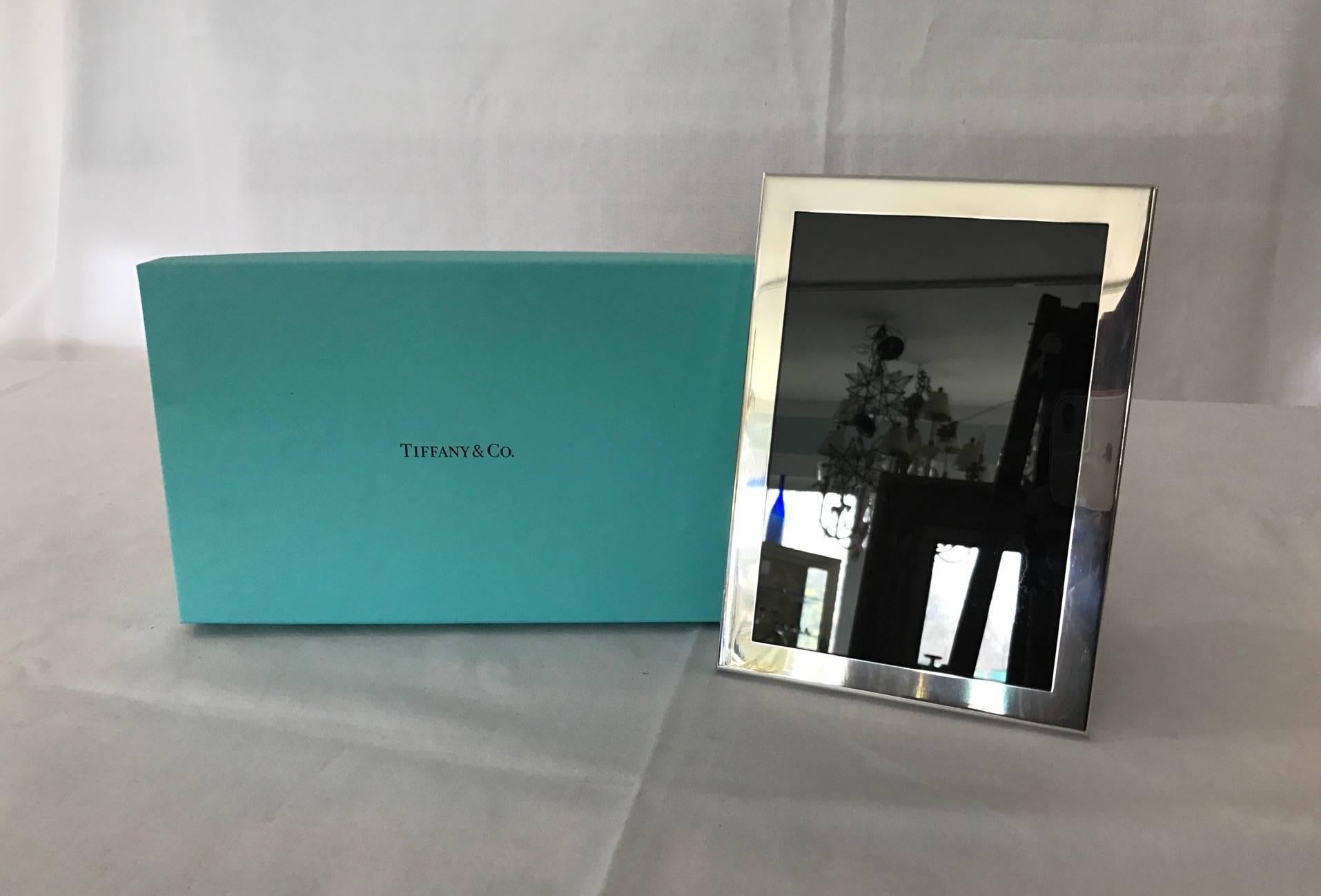 Tiffany blue box pewter frame. Measure: Holds 5 x 7 photograph. Really Pretty. Never Used. Stamped and with Tiffany blue pouch and box.