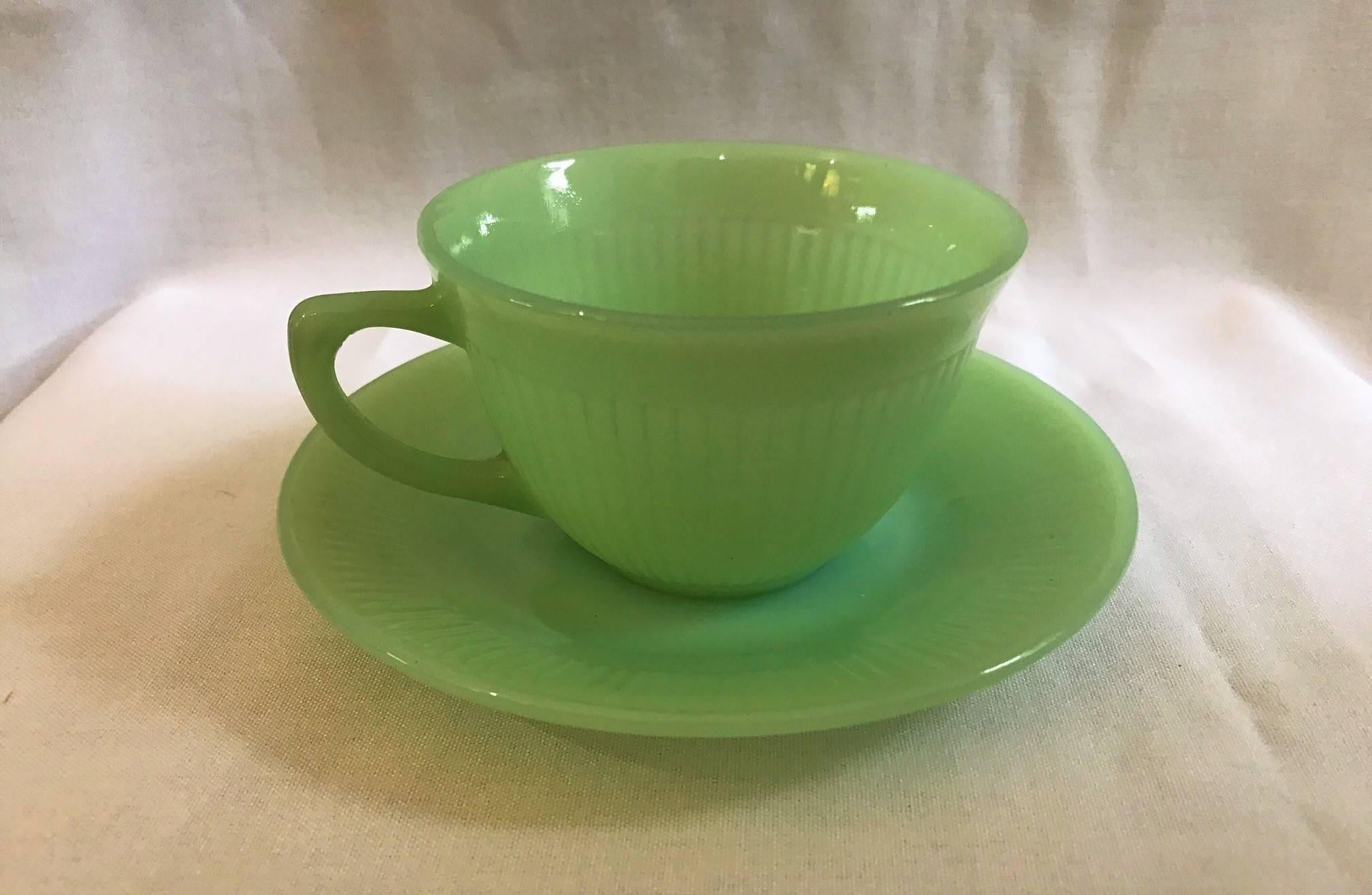 Terrific set of Jadeite - Fire King Anchor Hocking 12 cup 14 saucer set magnificent color! Fire King Jadeite, made of jade-green opaque milk glass. Popular in the mid-20th century. 

Cup:
H 2.5
D 3.75

Plate: 
D 6
Depth .5.