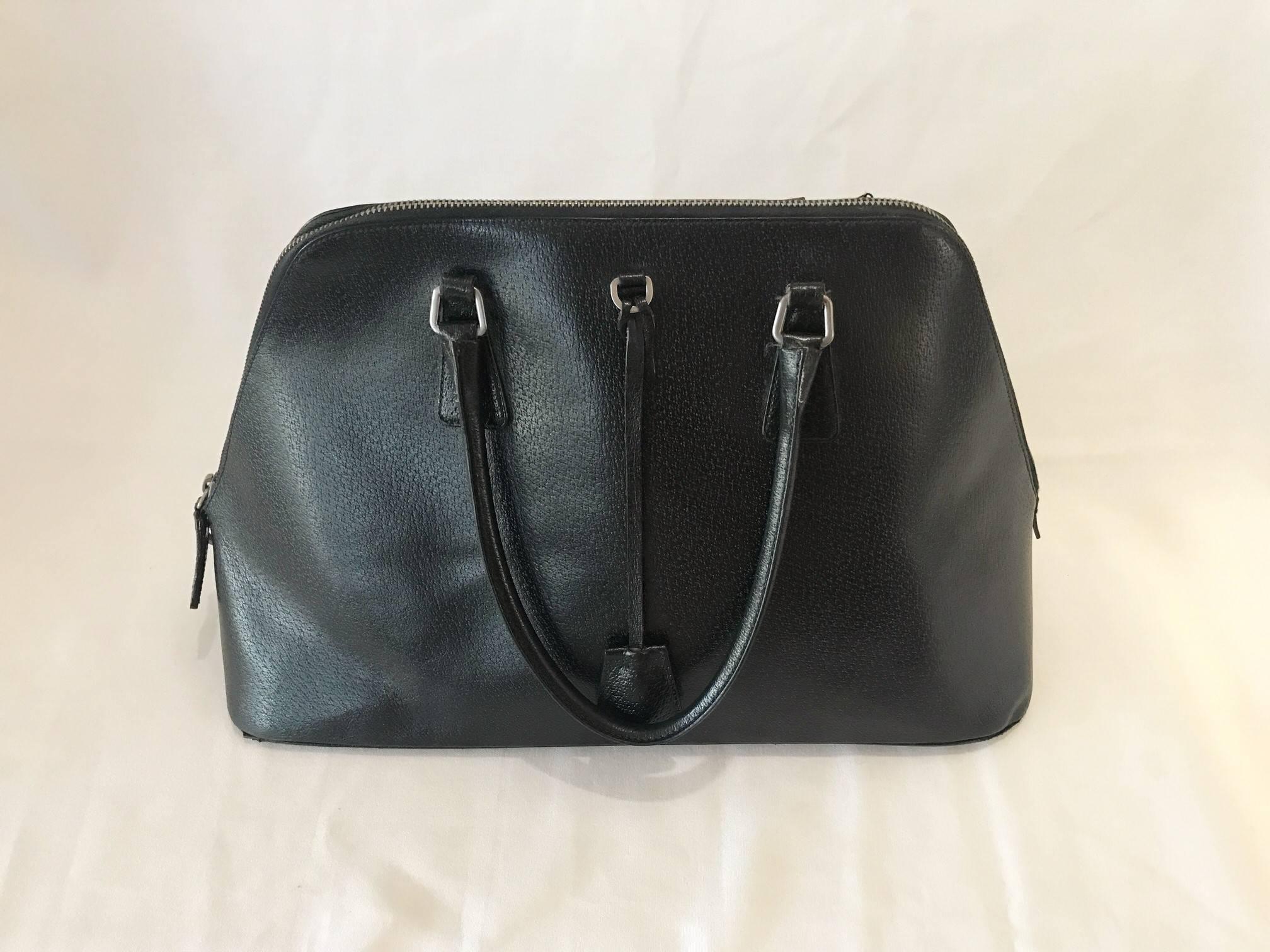 Black beauty Prada handbag with key and lock! Authentic Prada leather bag. Really great - rarely worn/used - Practically New! Clean and awesome authentic Prada.