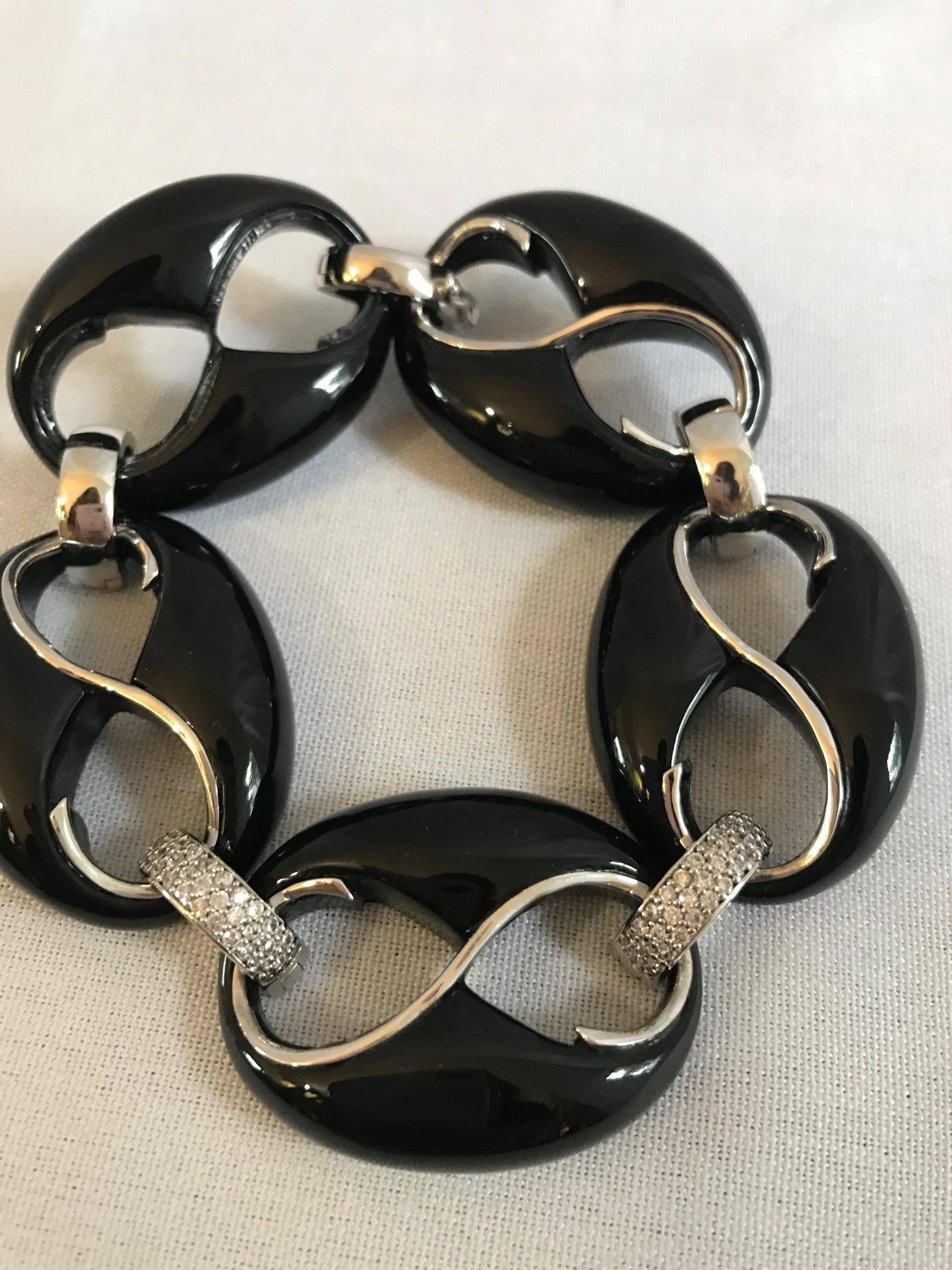 Jingle bells. A beautiful Cristina Sabatini silver and crystal encrusted bracelet. A great way to ring in the holiday. This is a stunning accessory to any outfit! A beautiful contrast in color.
  