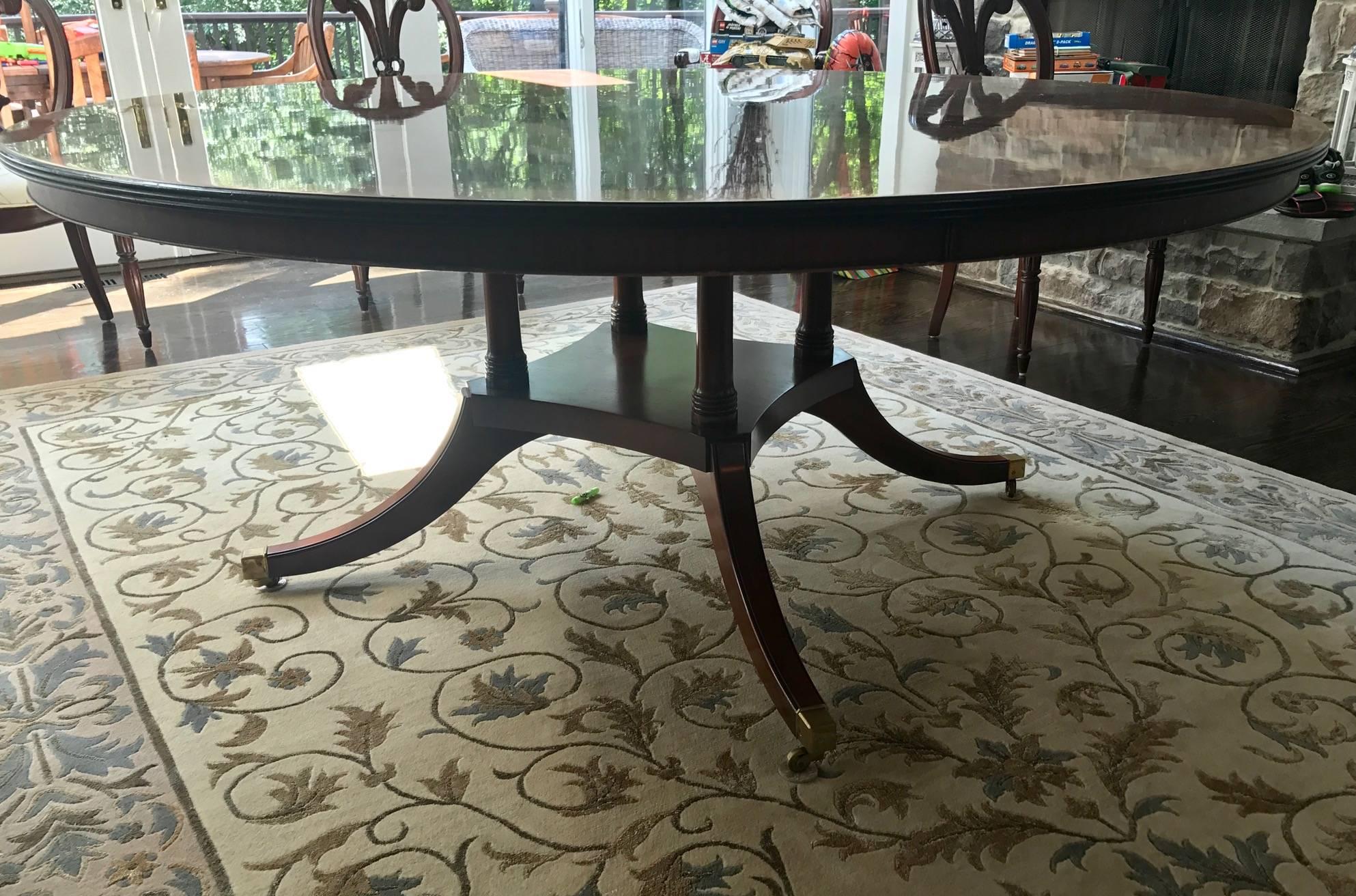 Monumental! Absolutely fabulous Maison Jansen style round mahogany dining table. This is a fantastic table! Beautifully stunning! A great piece from a great Westport Connecticut Estate!