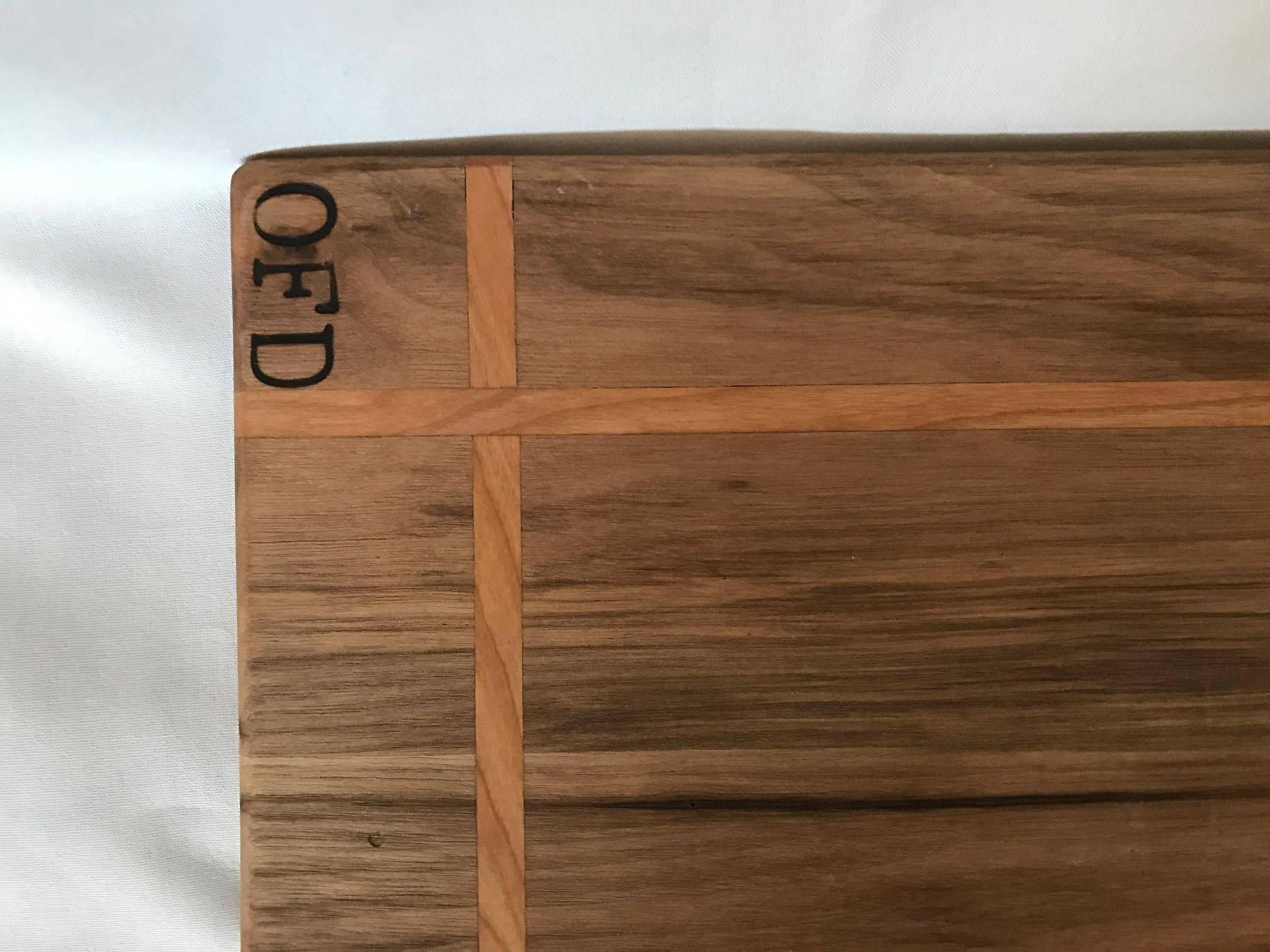 Handcrafted walnut and cherry inlay cutting board - custom-made mineral treated 100% food safe. This is a beautiful piece of art and craftsmanship. Would be beautiful in your home or as a gift IDEA for that someone special (chef)! 

Free