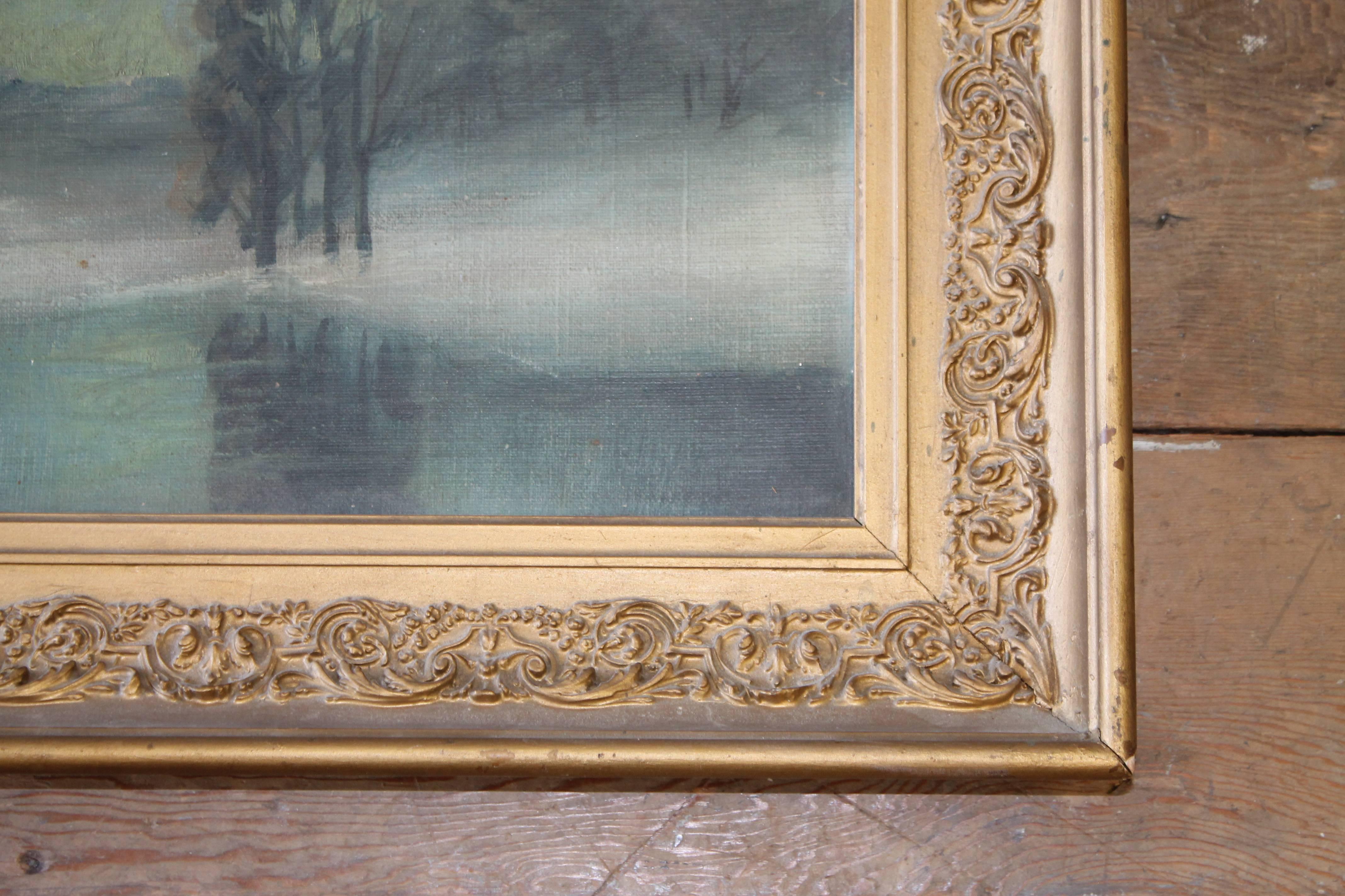 Beautiful river landscape oil on canvas, with fading sailboats in the distance. Soft grey-blue tones in a giltwood carved decorative frame. This is in good condition, minor scratches or scuffs may be present. The frame looks to be in good condition
