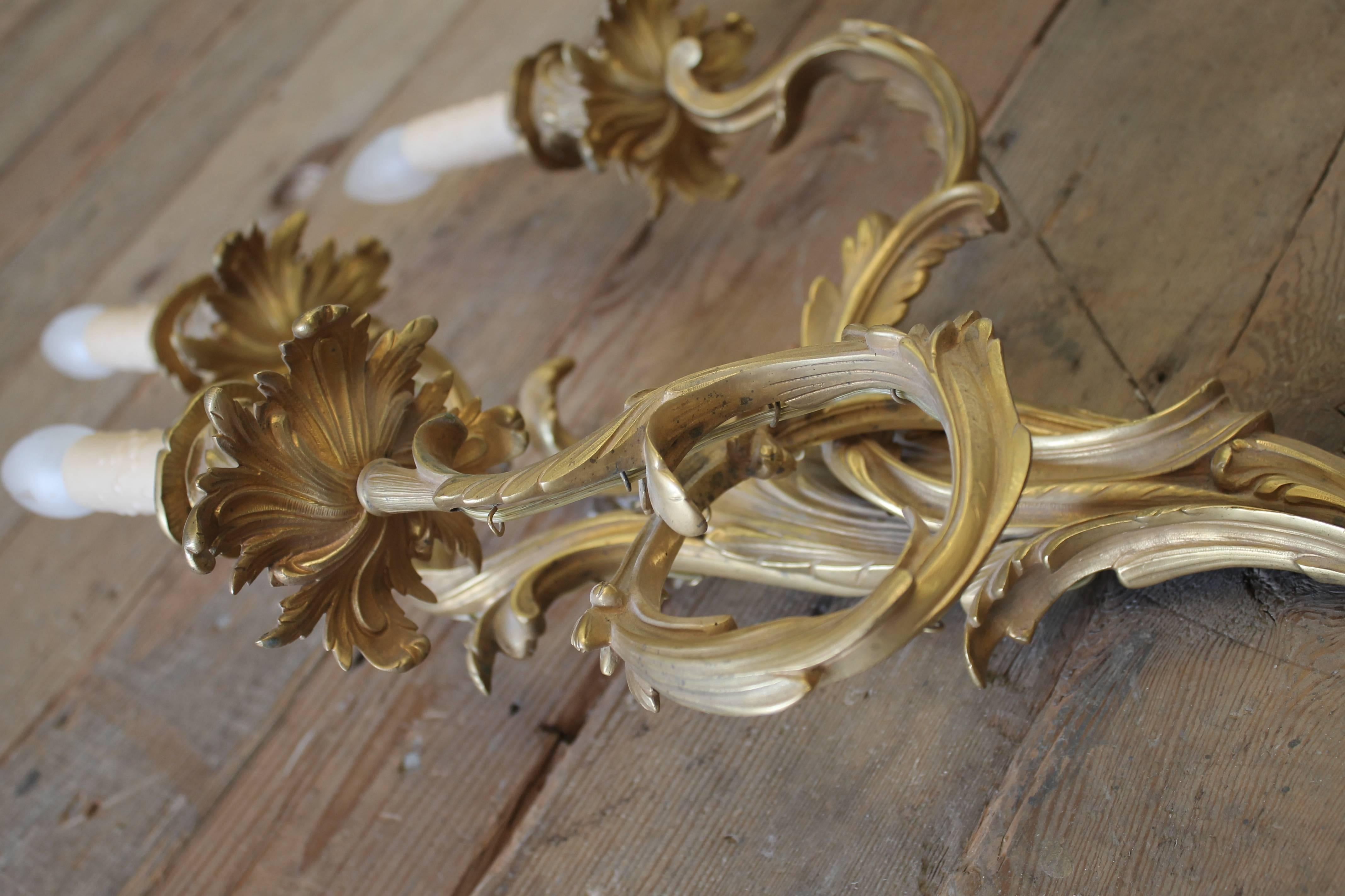 French Pair of Louis XV Style Gilt Foliate Three-Light Wall Sconces