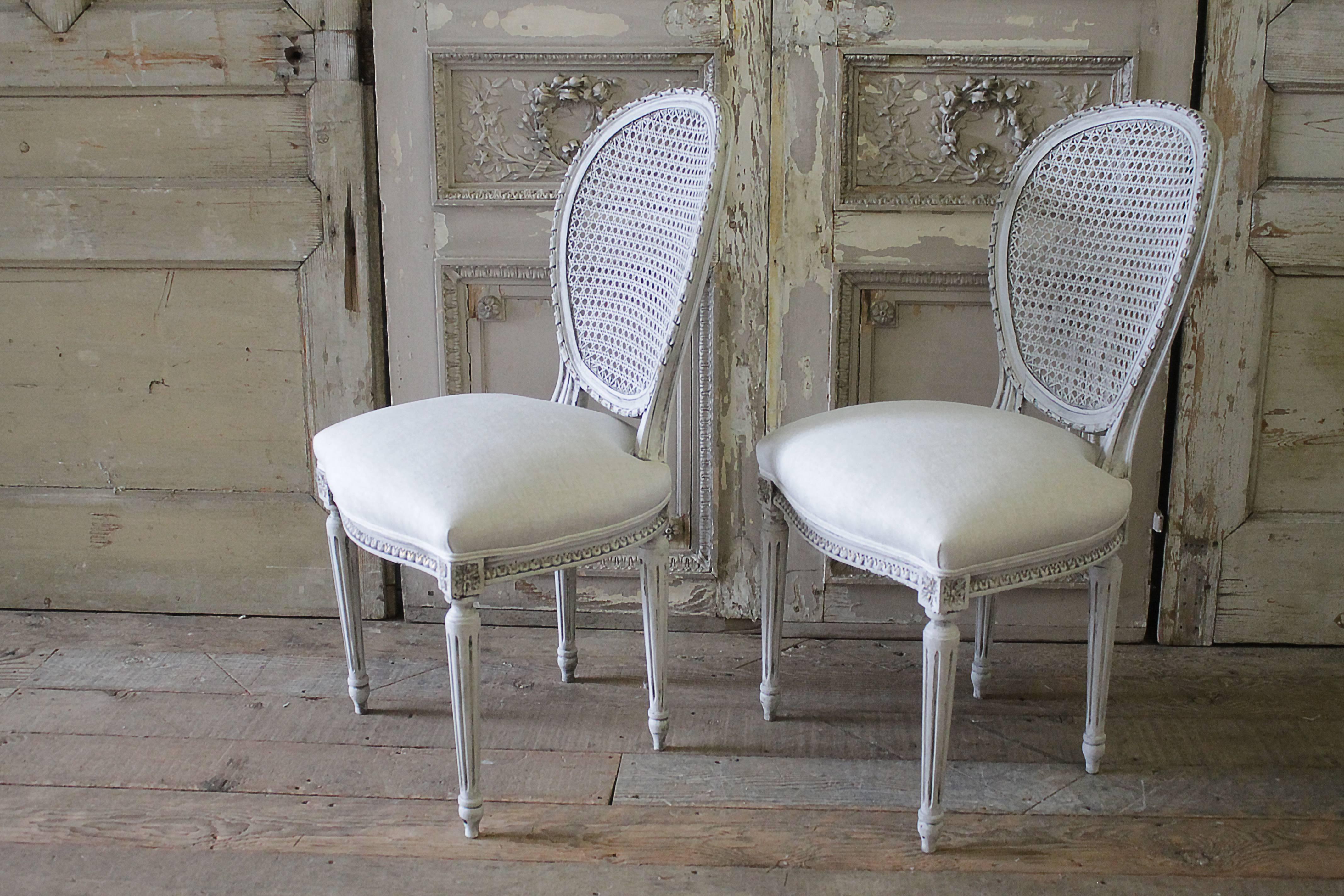 Linen Pair of Antique French Louis XVI Style Cane Back Side Chairs
