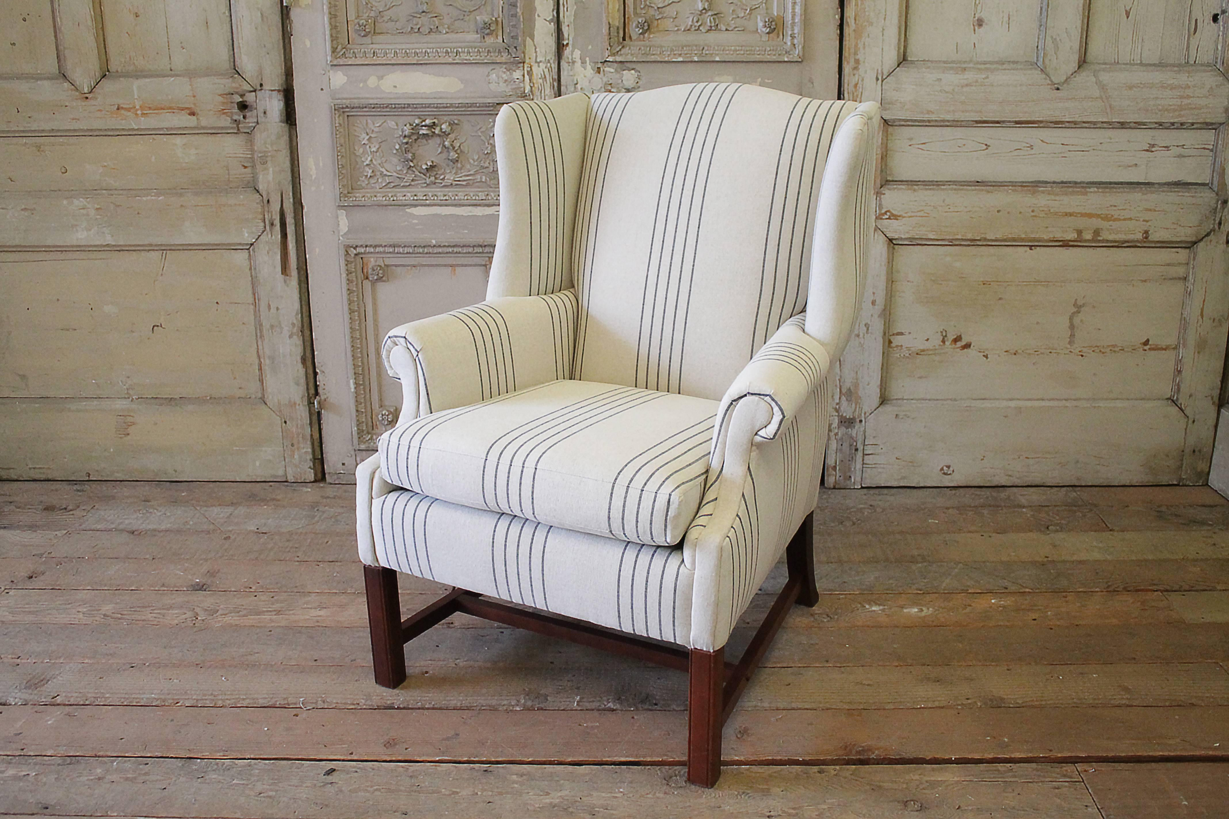 Handsome wing chair, with cherry legs, has been reupholstered in a 100% pure French Linen. The linen is natural flax, with a black stripe. Legs are solid and sturdy. The seat foam, with a removable seat cushion.
Measures: 41