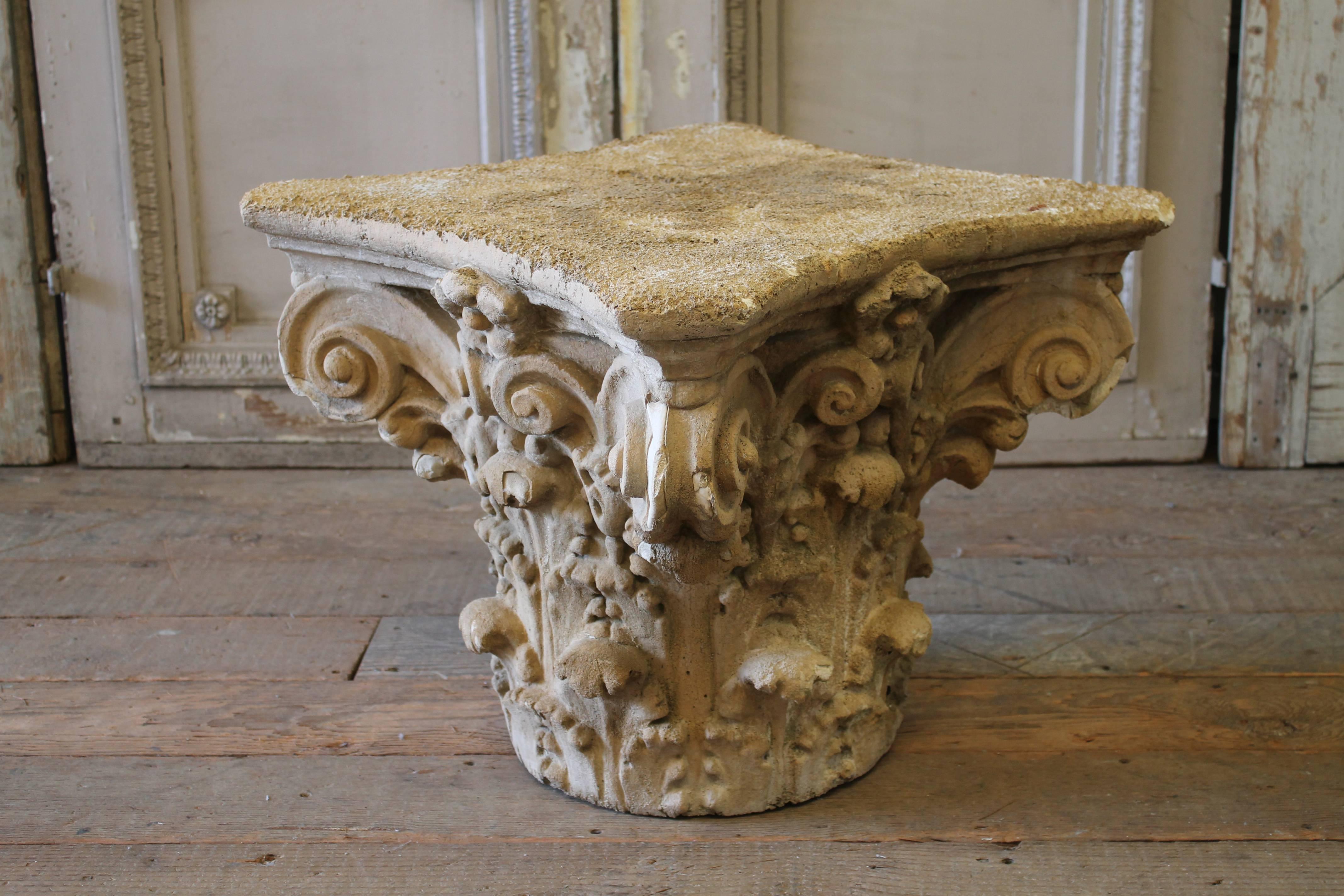 Beautiful aged plaster capitol with chippy finish, in the taupe, creamy color finish. Perfect height for use as a side table, finished on all four sides as shown.
Somewhat heavy, this capital sits level, and has a porous top. The inside is hollow.