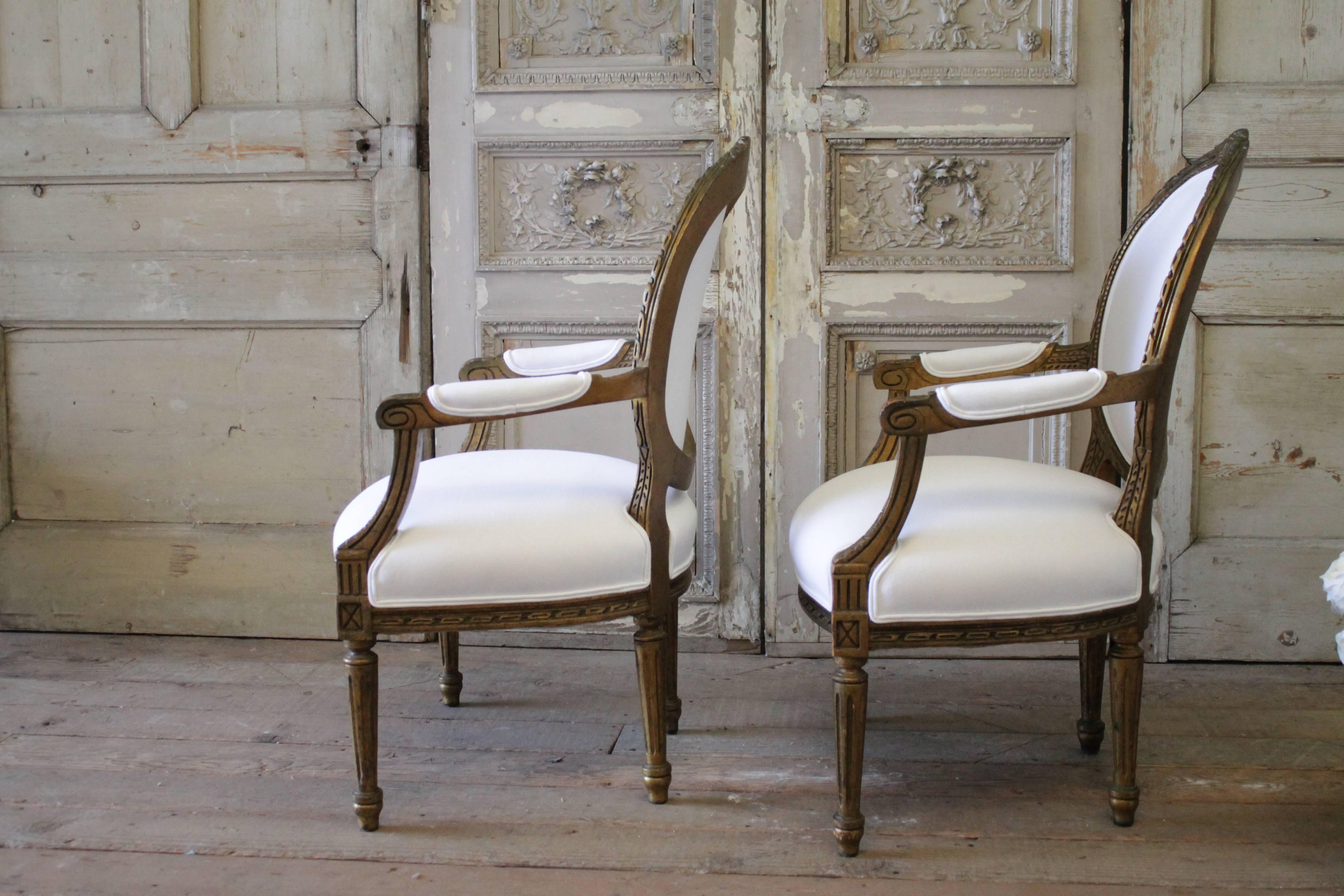 Linen Pair of 19th Century Giltwood Ribbon Carved Louis XVI Style French Chairs