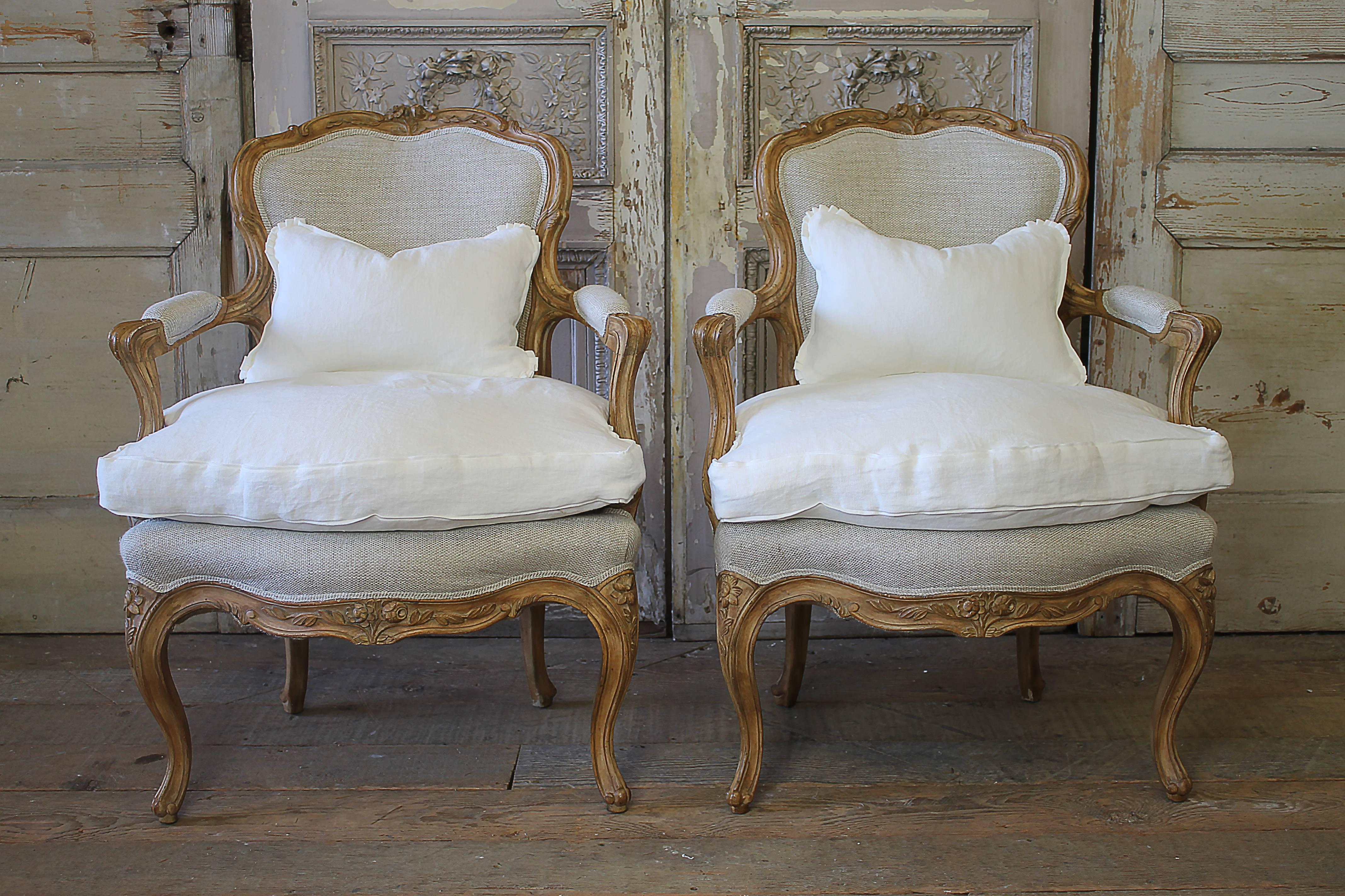 Lovely pair of antique walnut carved French Louis XV style chairs. We have upholstered these in our 100% pure Irish Burlap style linen. The linen is soft to the touch, and has a two-tone natural and soft white weave. The down seat cushions were slip