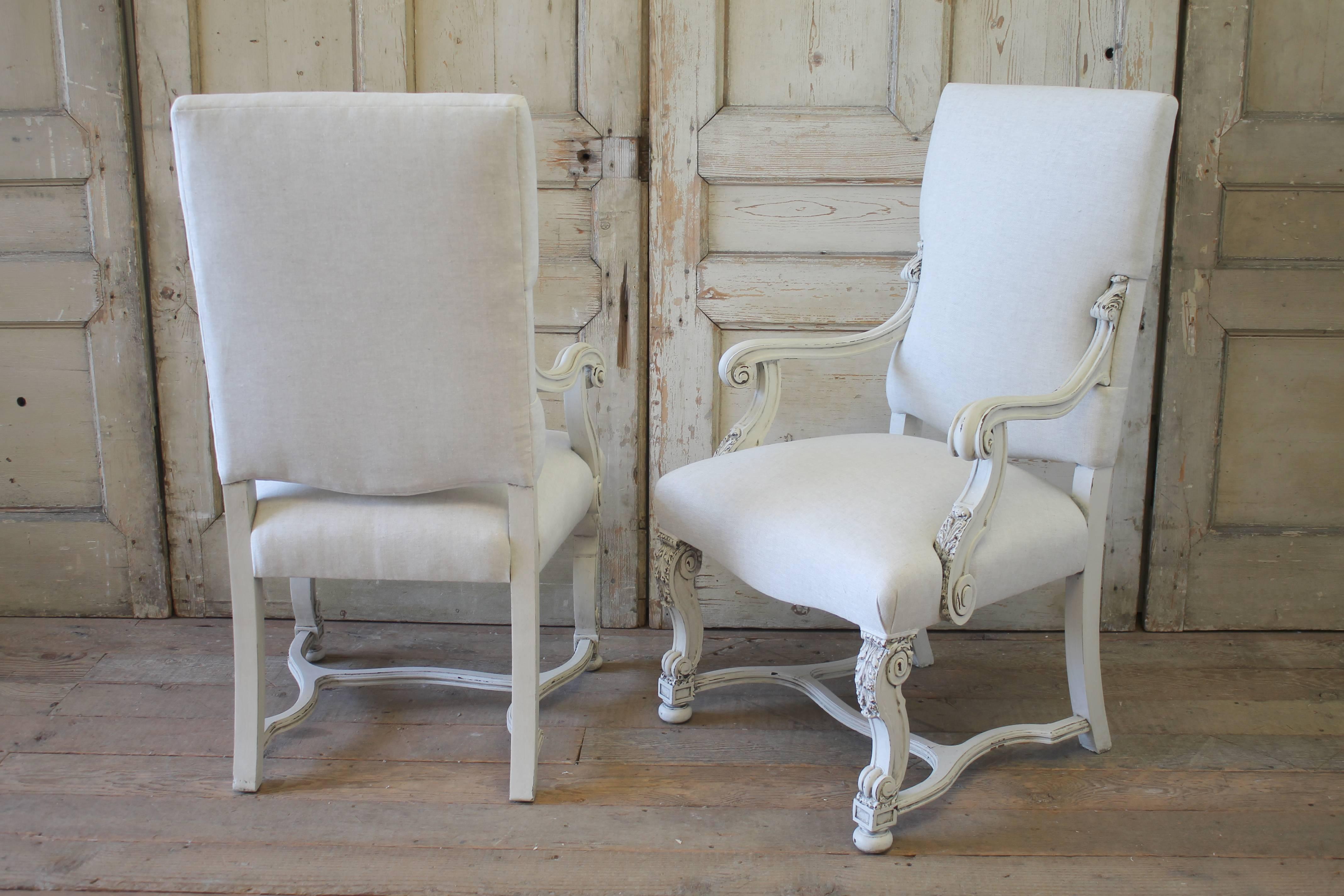 Beautifully upholstered Renaissance Revival dining chairs with delicate trim detail. This set includes six side chairs and two armchairs. Upholstered in a greige natural linen, color is oatmeal that leans more towards the grey side. You can linger