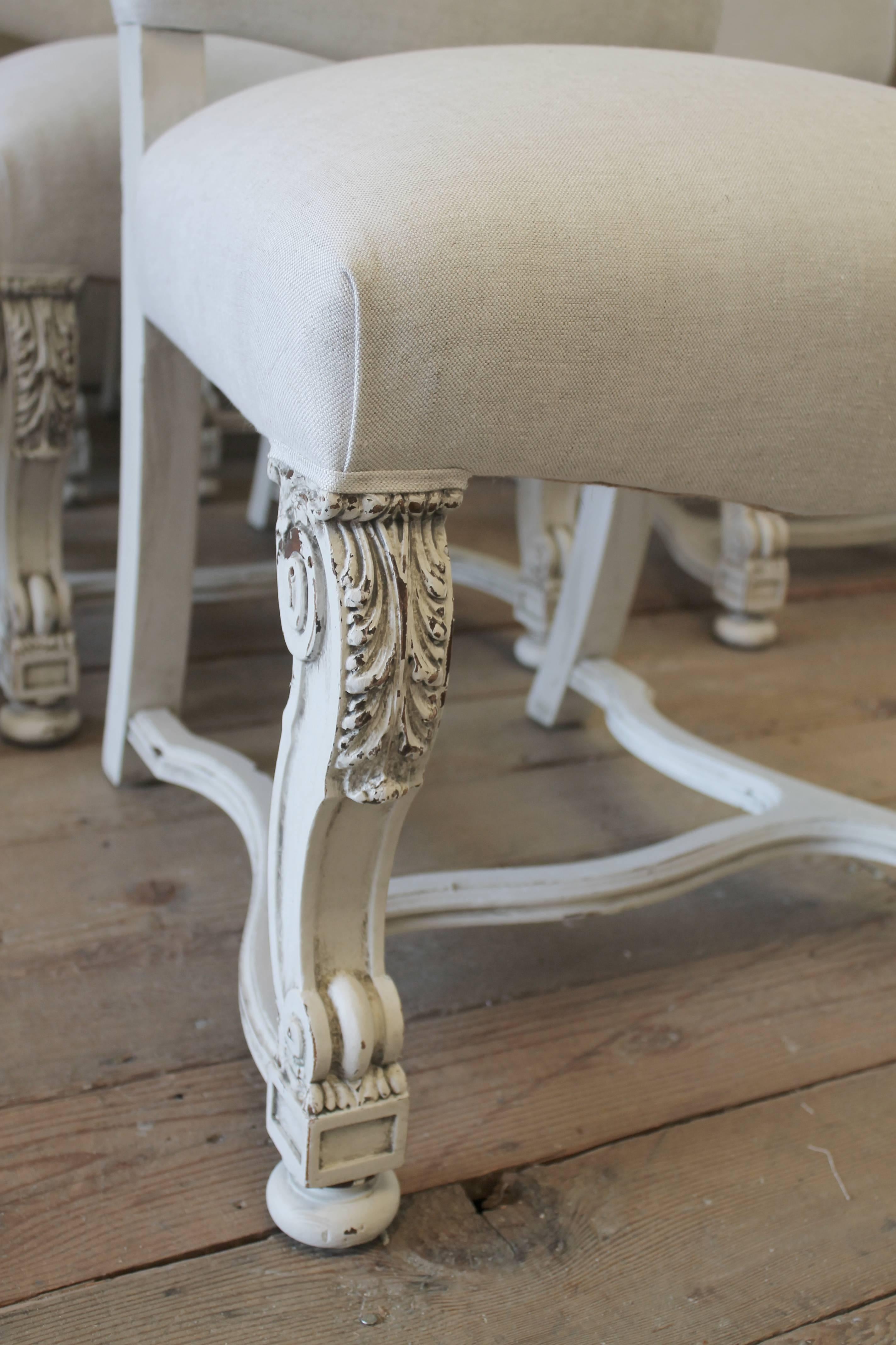 20th Century Set of Eight Carved and Linen Upholstered Renaissance Dining Chairs