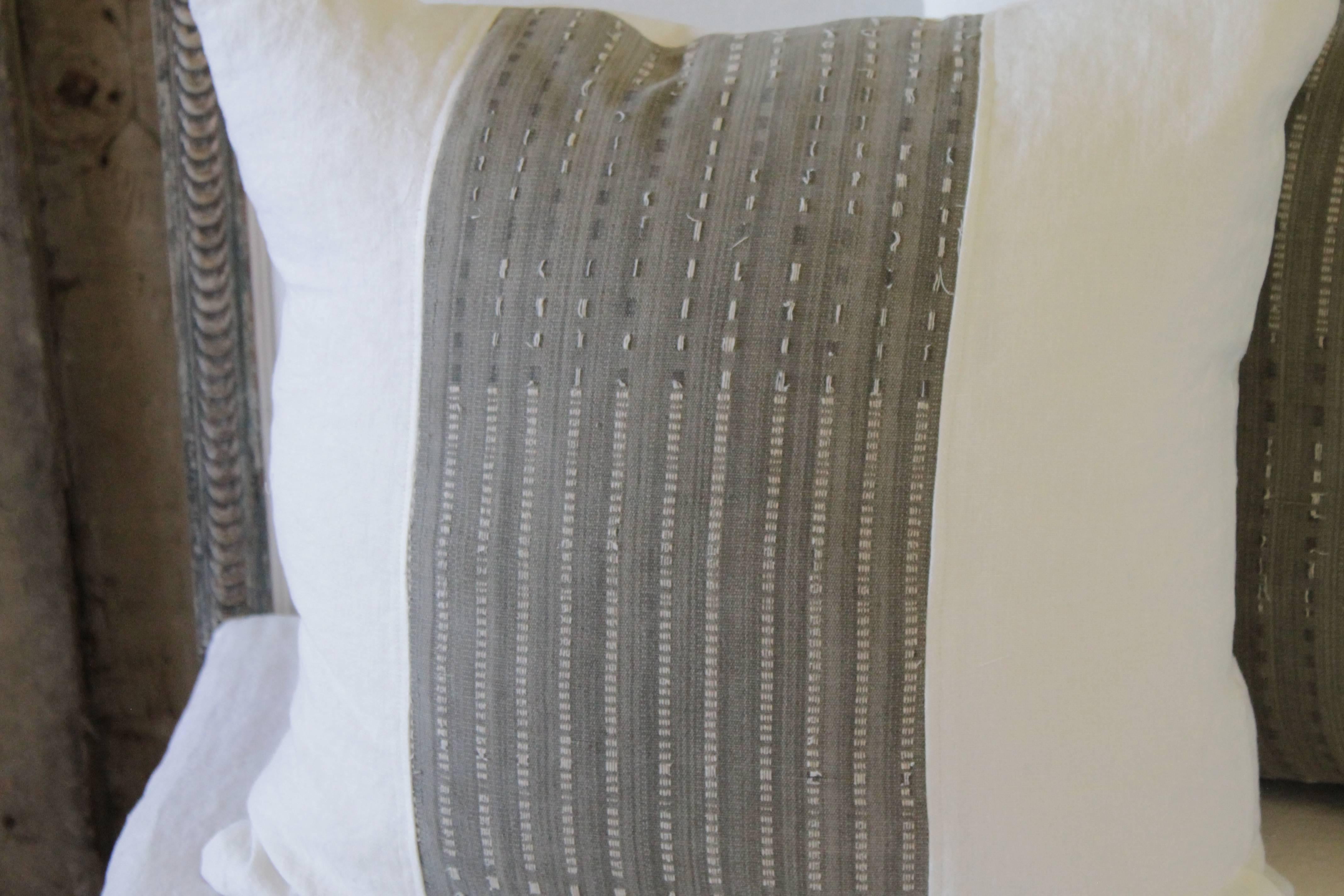 Pair of pillows made from a vintage textile know as an African mud cloth. This mud cloth is a grey soft woven cotton, with white threads woven through to create a beautiful pattern. As shown some threads have a tat edge. We have created this color