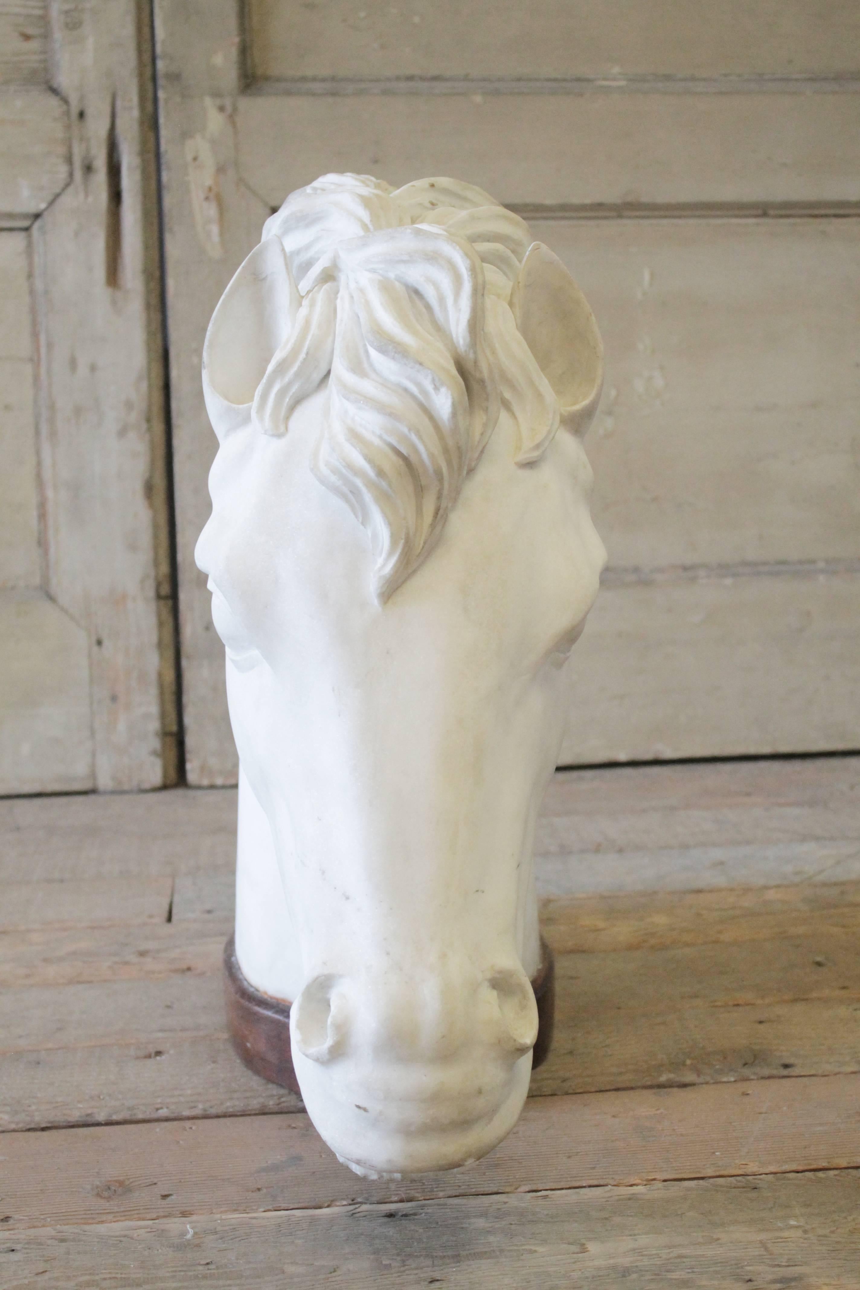 Beautiful large carved marble horse head. Marble has patina, and is white to light grey tone with grey veins, very light in color. No major damage, just subtle surface scuffs, or minor patina. The base is carved of walnut, with subtle scuffs or