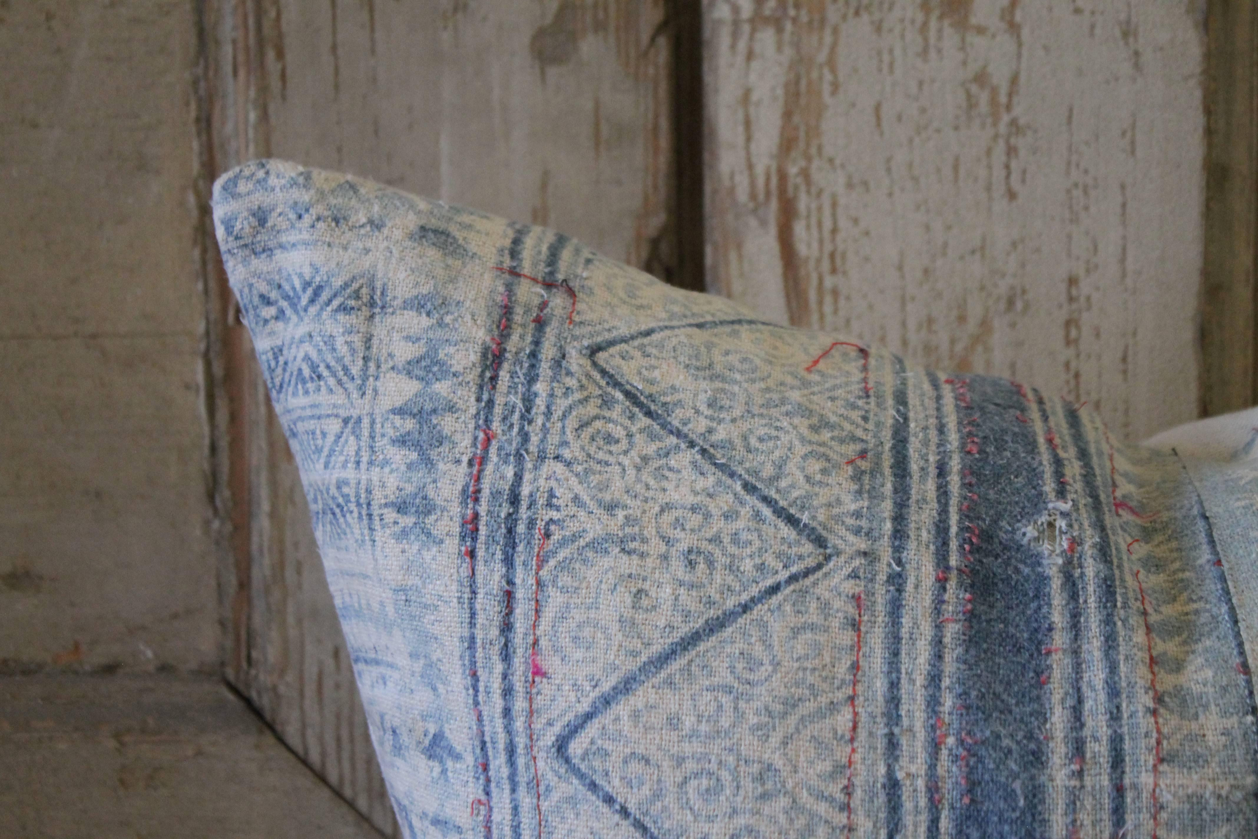 A beautiful light blue batik pattern, these pillows are custom-made in our studios from vintage textiles. The front of the pillow are a beautiful pattern, with light and dark blue patterns, on a nubby thick textural fabric. There are accents of a