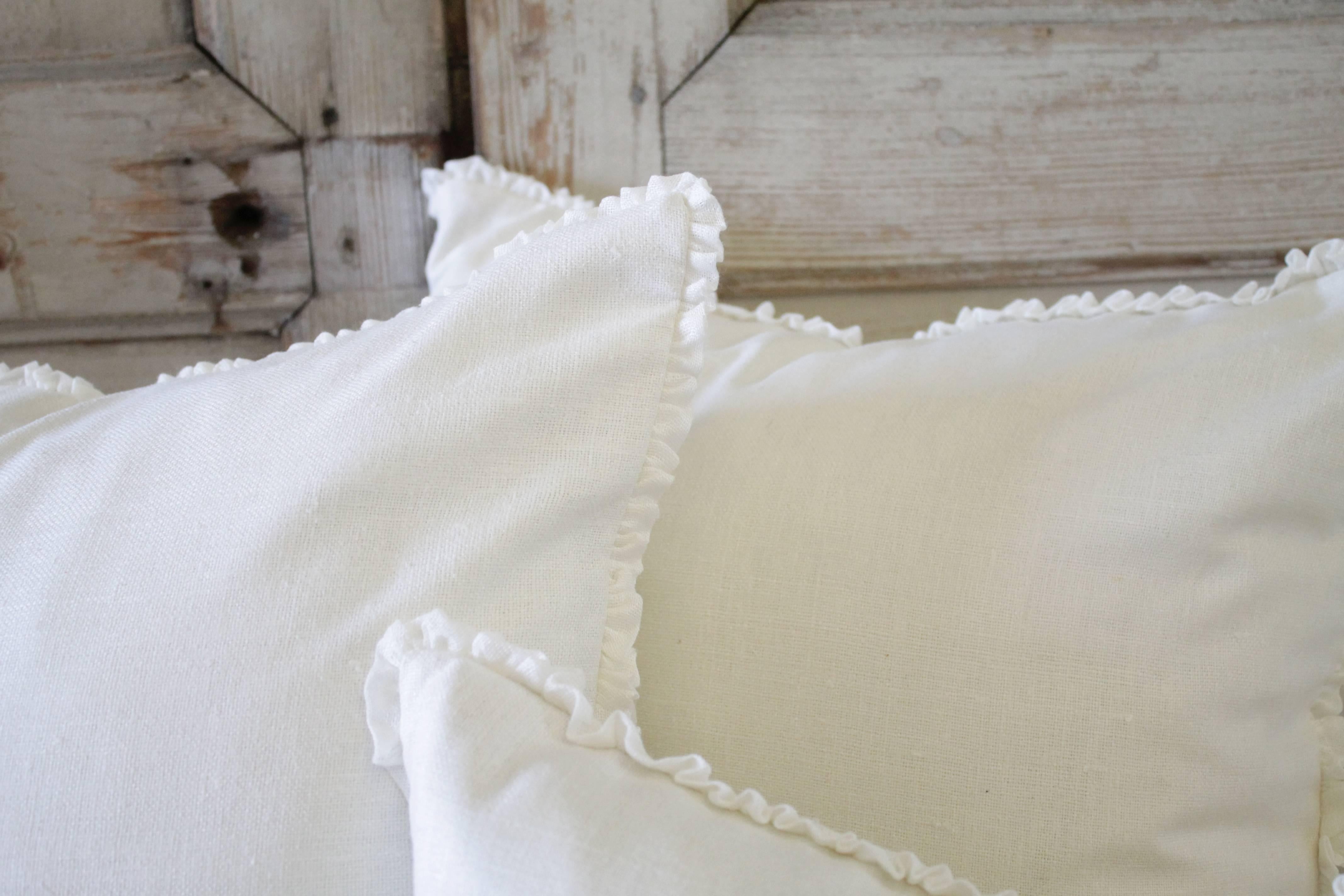 Beautiful linen textured silk pillows with a linen voile gathered ruffle edge.
Zipper closure includes down or feather insert.
 