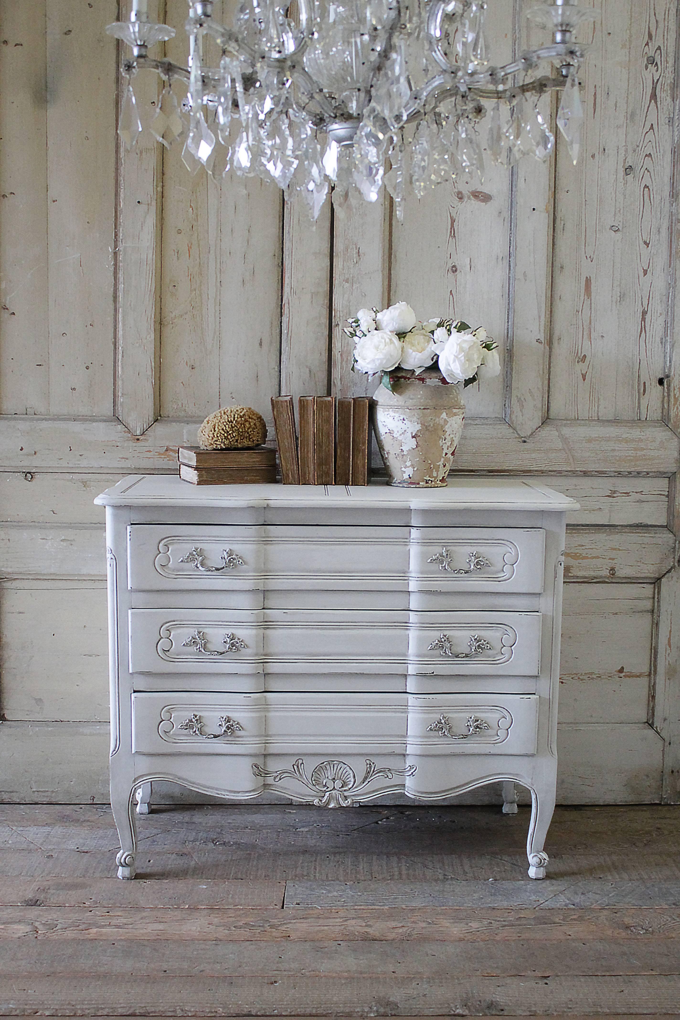 Lovely three-drawer solid wood dresser commode. Painted in our signature oyster white, with subtle distressed edges, and finished with an antique patina glaze. Three solid wood drawers with dovetail open and close with ease.
Measures: 43.5