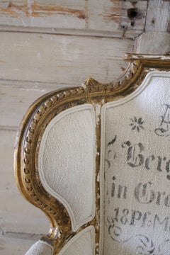 Antique French Louis XVI Style Wing Chair in Antique Grain Sack Upholstery